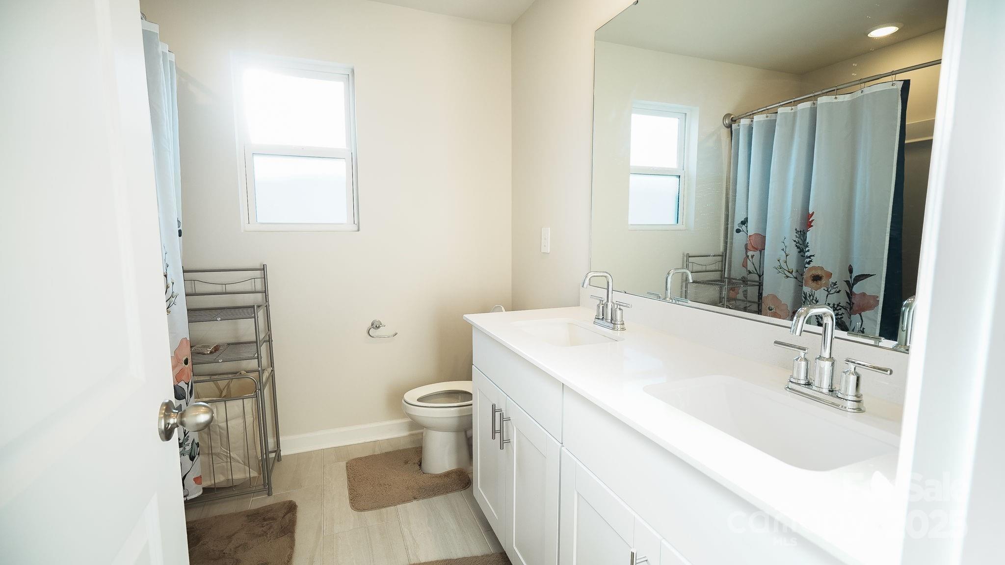 486 Olympia Way York, SC 29745 - Photo 28 of 34 a bathroom with a sink toilet and shower