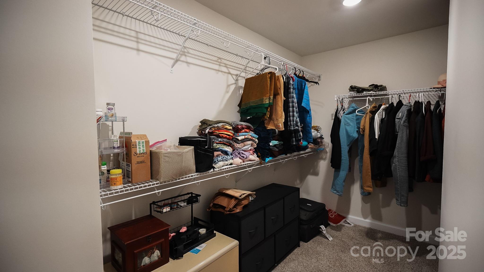 486 Olympia Way York, SC 29745 - Photo 31 of 34 a view of walk in closet with clothes and shoes