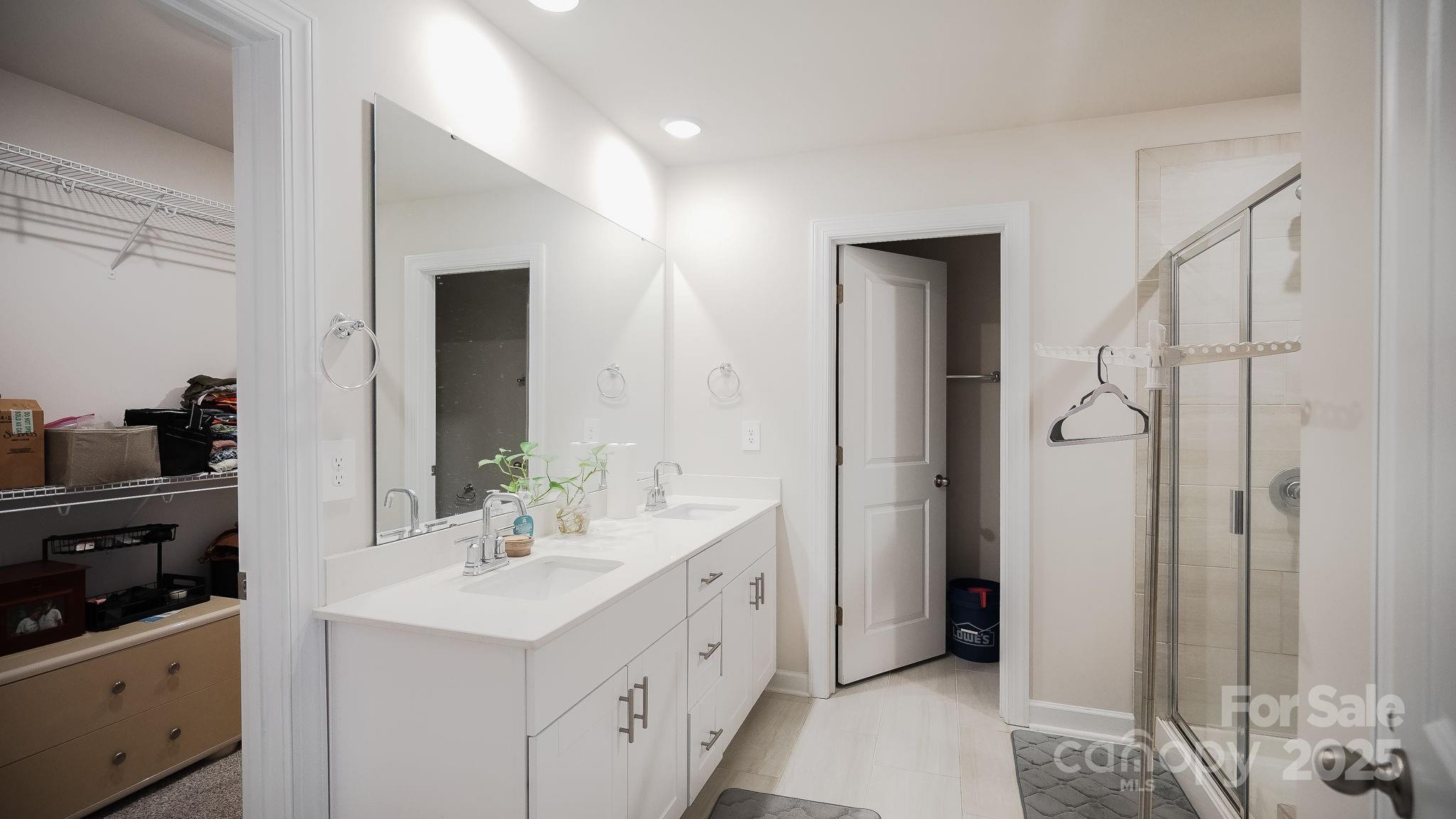 486 Olympia Way York, SC 29745 - Photo 34 of 34 a spacious bathroom with a double vanity sink and mirror
