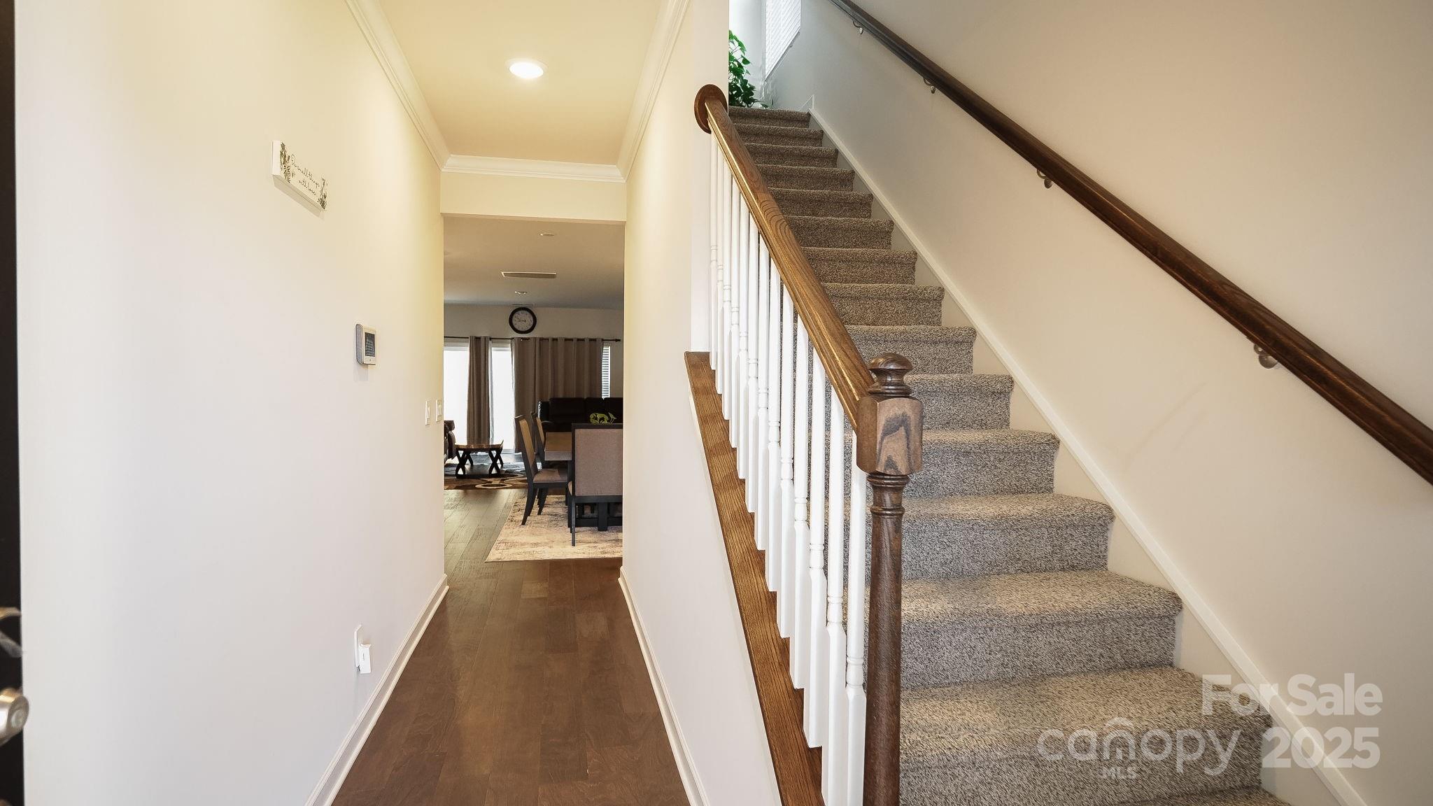 486 Olympia Way York, SC 29745 - Photo 5 of 34 a view of a hallway with wooden floor and staircase