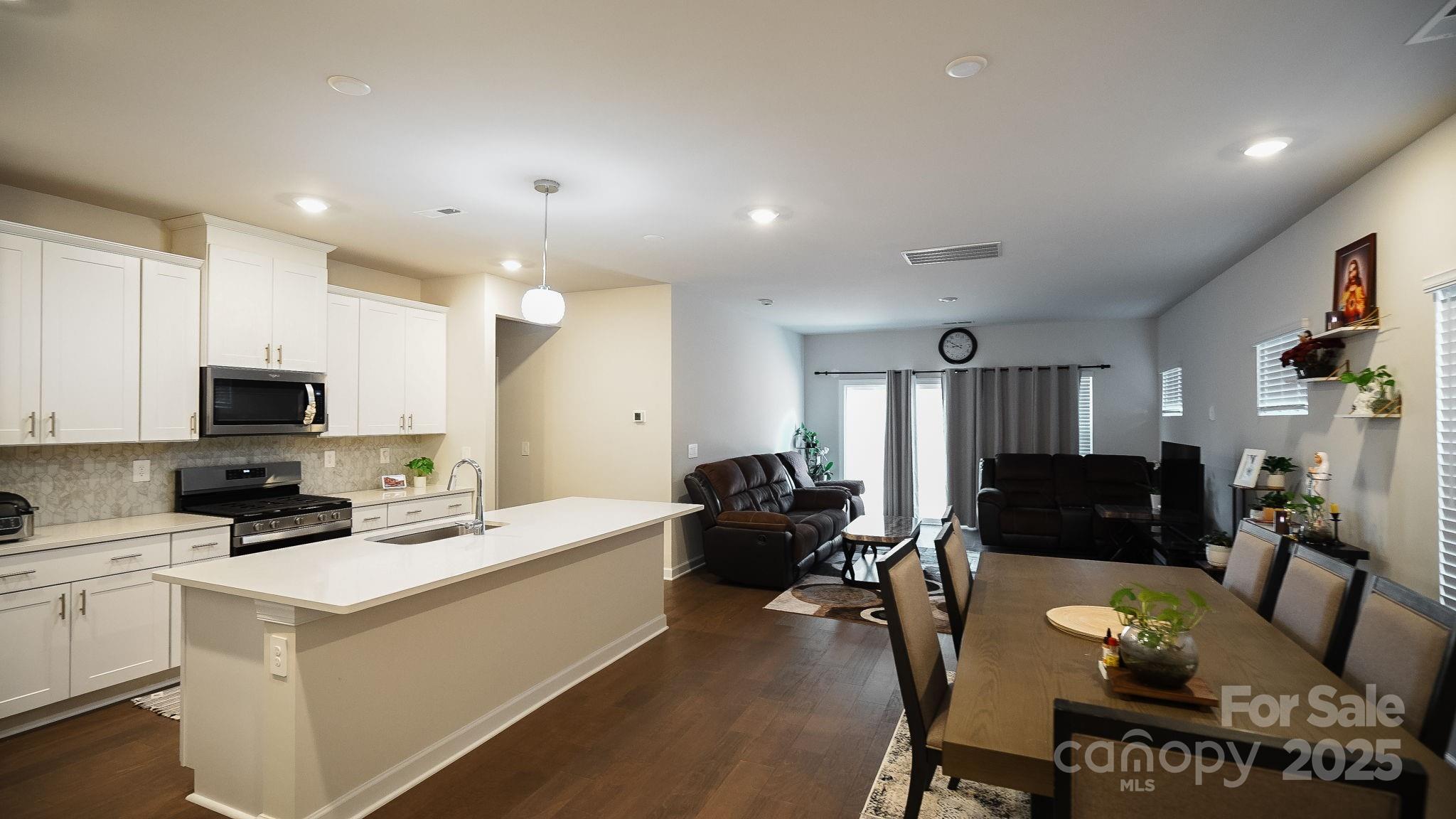 486 Olympia Way York, SC 29745 - Photo 6 of 34 a living room with furniture a flat screen tv and a refrigerator