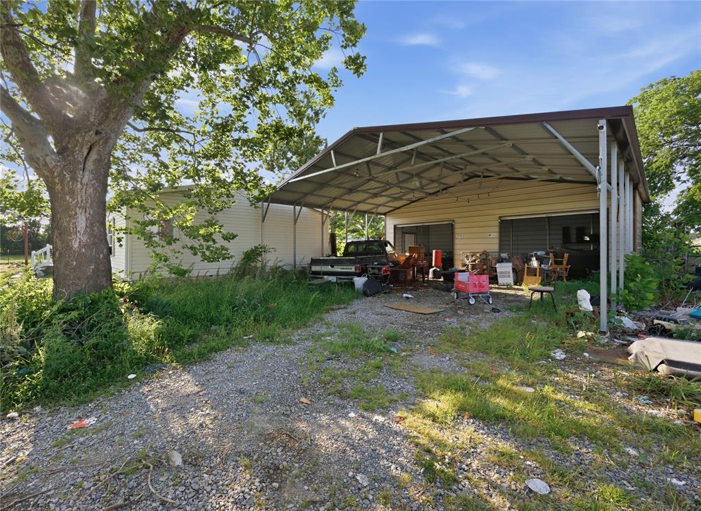 2449 East Fm 120 Denison, TX 75021 - Photo 6 of 30 a view of a chairs in a backyard