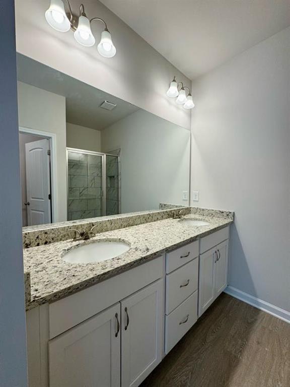 0 Harvest Church Road, Unit 2 Clarkesville, GA 30523 - Photo 28 of 33 a bathroom with a granite countertop sink and a mirror