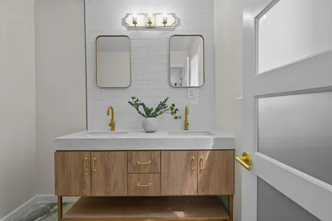 a bathroom with a sink and a mirror