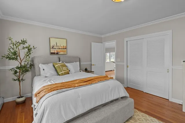 a bedroom with bed and window