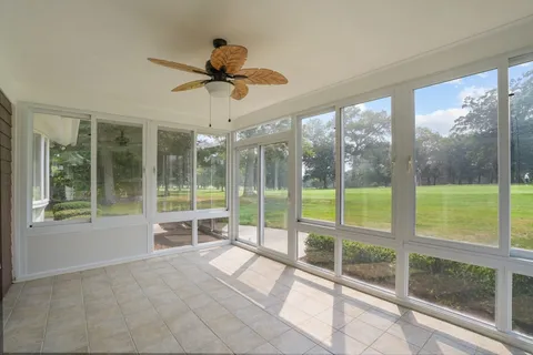 a view of a living room and balcony