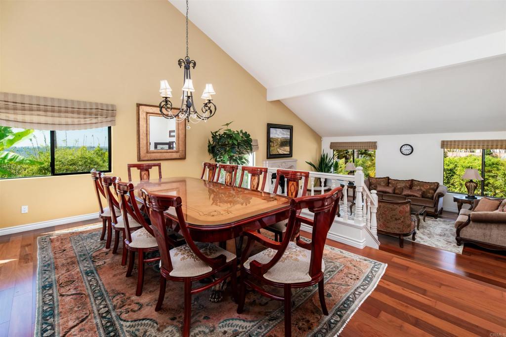 6541 Vispera Place Carlsbad, CA 92009 - Photo 11 of 54 a view of a dining room with furniture window and wooden floor