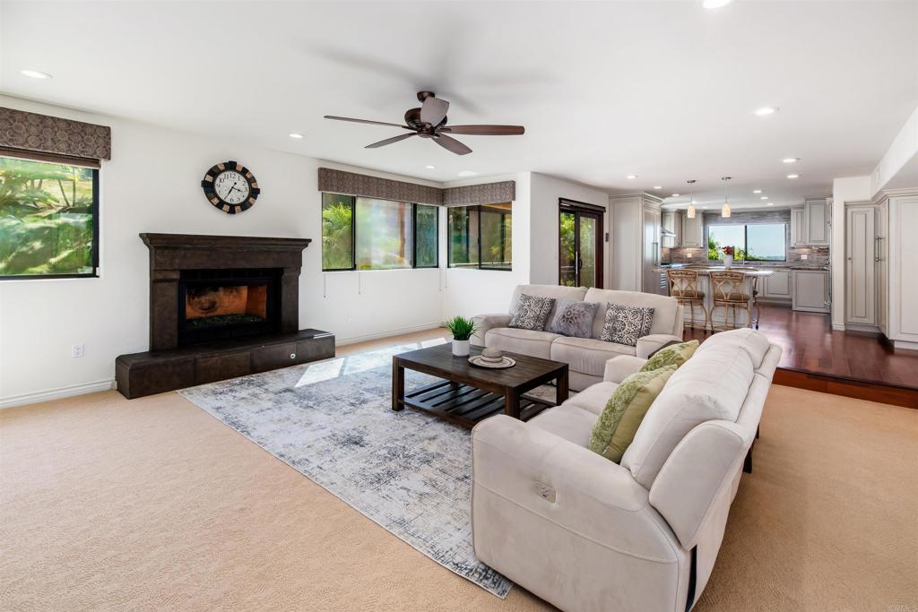 6541 Vispera Place Carlsbad, CA 92009 - Photo 15 of 54 a living room with furniture and a fireplace