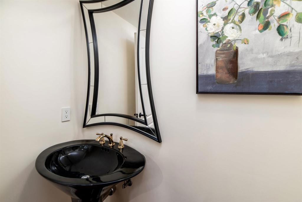 6541 Vispera Place Carlsbad, CA 92009 - Photo 19 of 54 a bathroom with a sink and mirror
