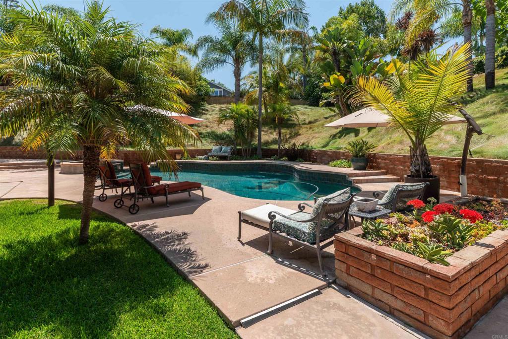 6541 Vispera Place Carlsbad, CA 92009 - Photo 2 of 54 a view of a garden with sitting area