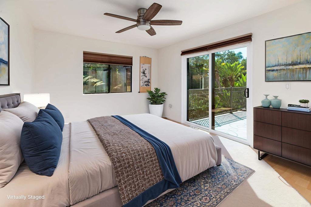 6541 Vispera Place Carlsbad, CA 92009 - Photo 34 of 54 a bedroom with a bed and window