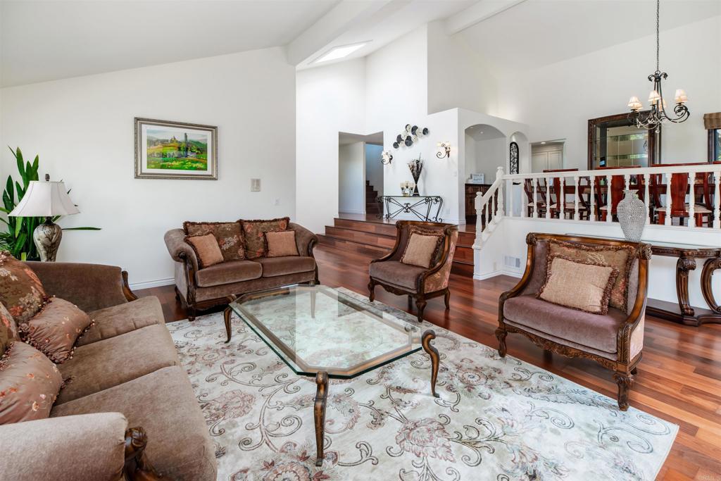 6541 Vispera Place Carlsbad, CA 92009 - Photo 10 of 54 a living room with furniture and wooden floor
