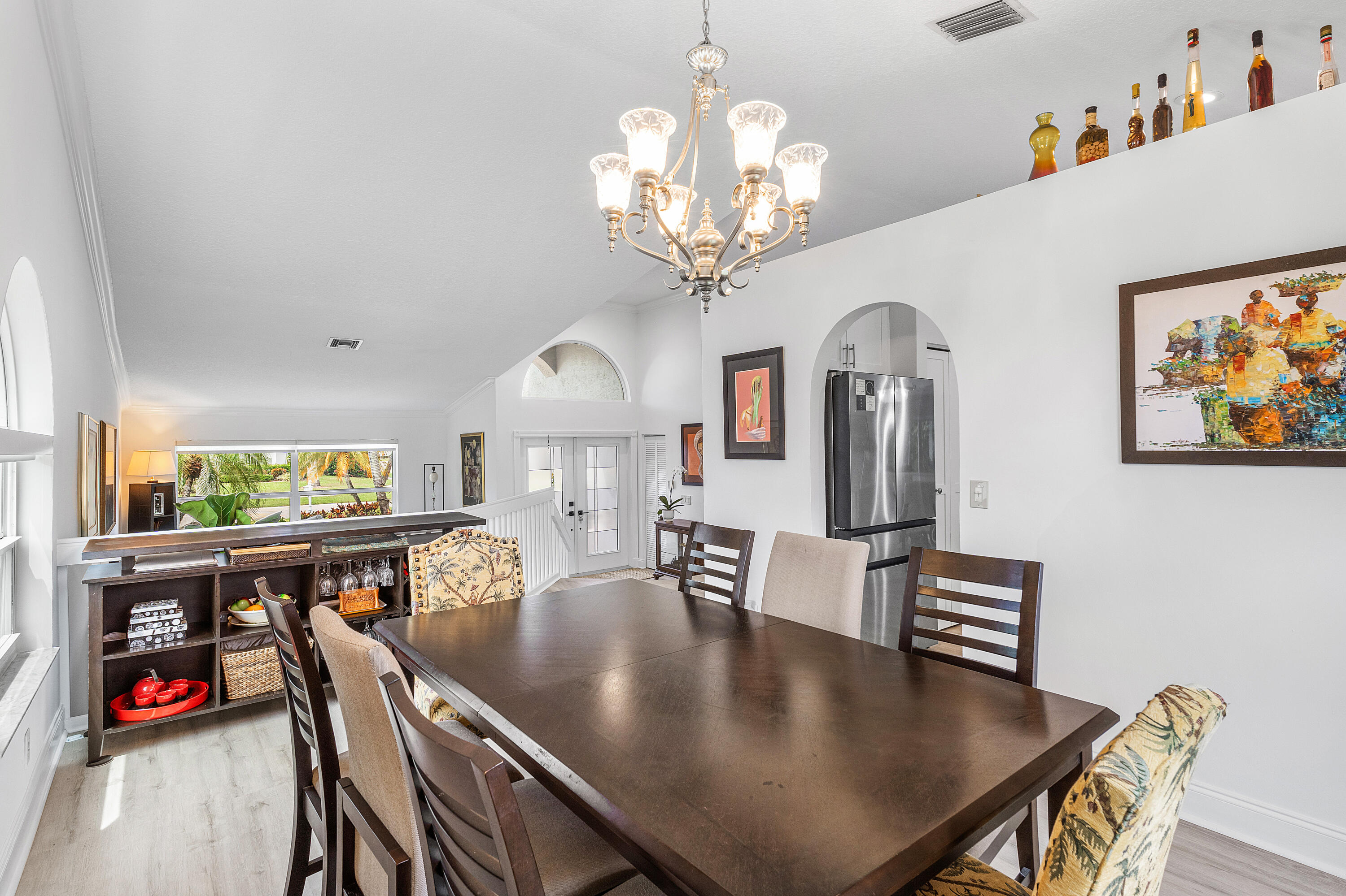 10824 Tea Olive Lane Boca Raton, FL 33498 - Photo 11 of 76 a view of a dining room with furniture and chandelier