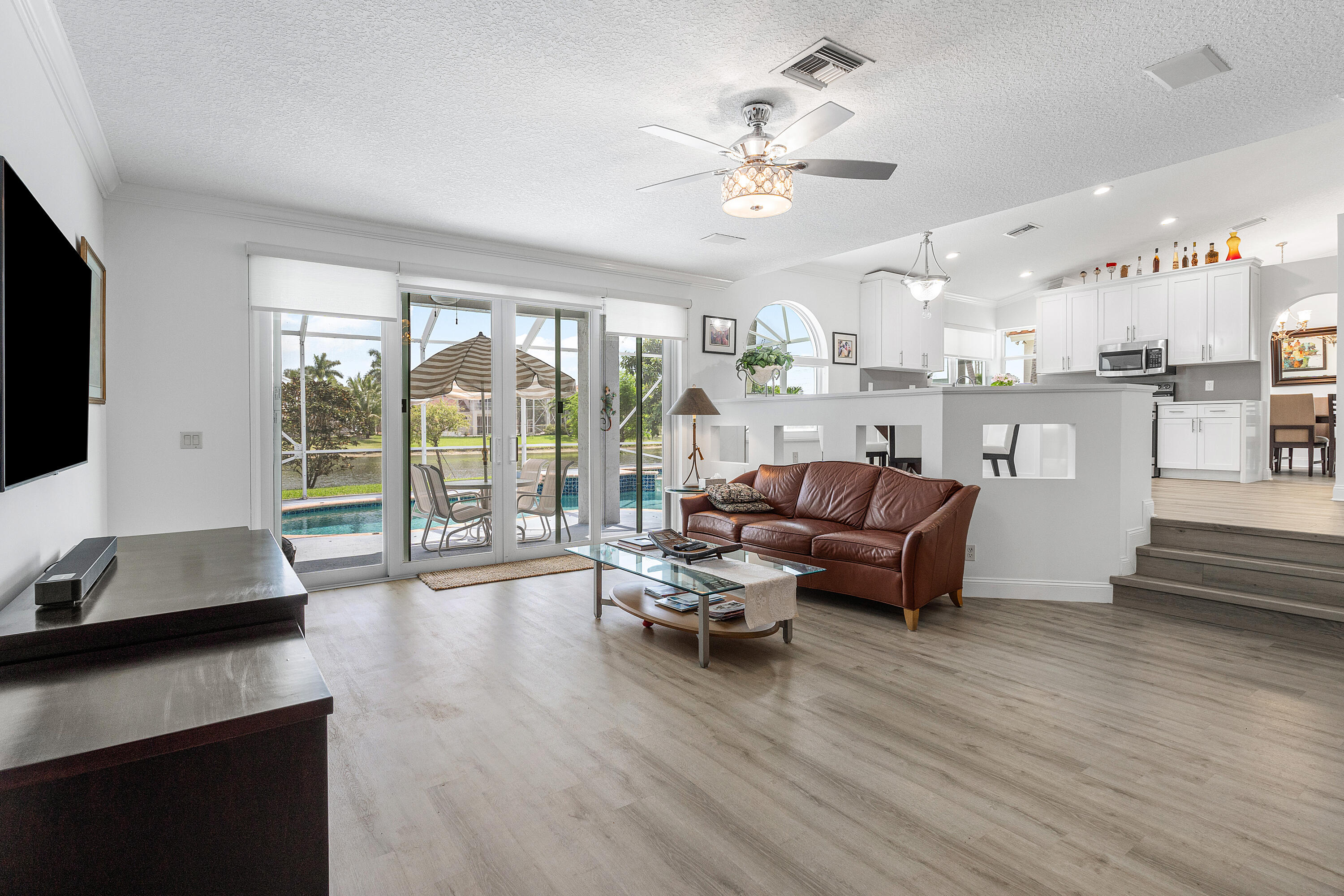 10824 Tea Olive Lane Boca Raton, FL 33498 - Photo 21 of 76 a living room with furniture and a flat screen tv