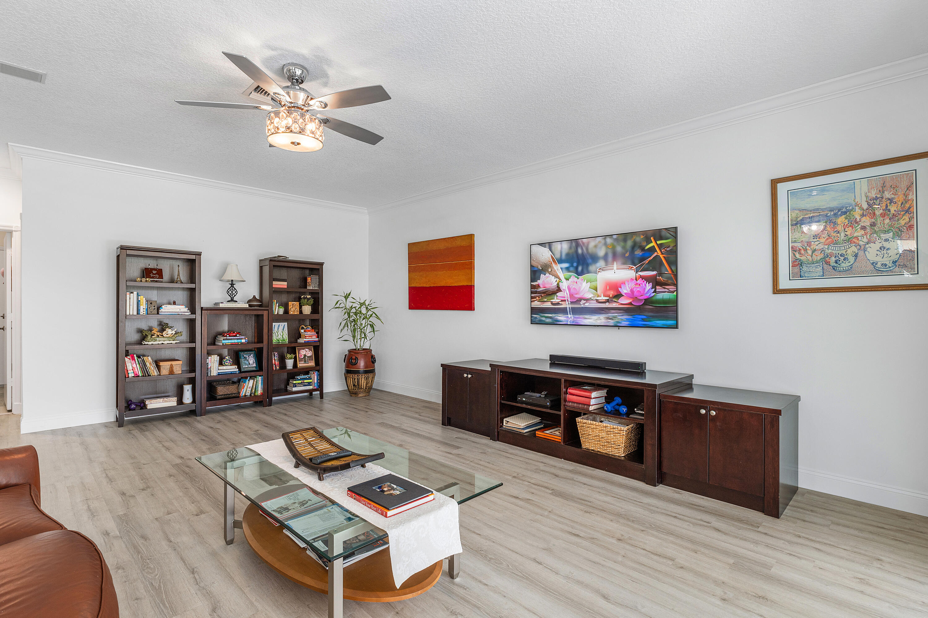 10824 Tea Olive Lane Boca Raton, FL 33498 - Photo 23 of 76 a living room with furniture and a flat screen tv