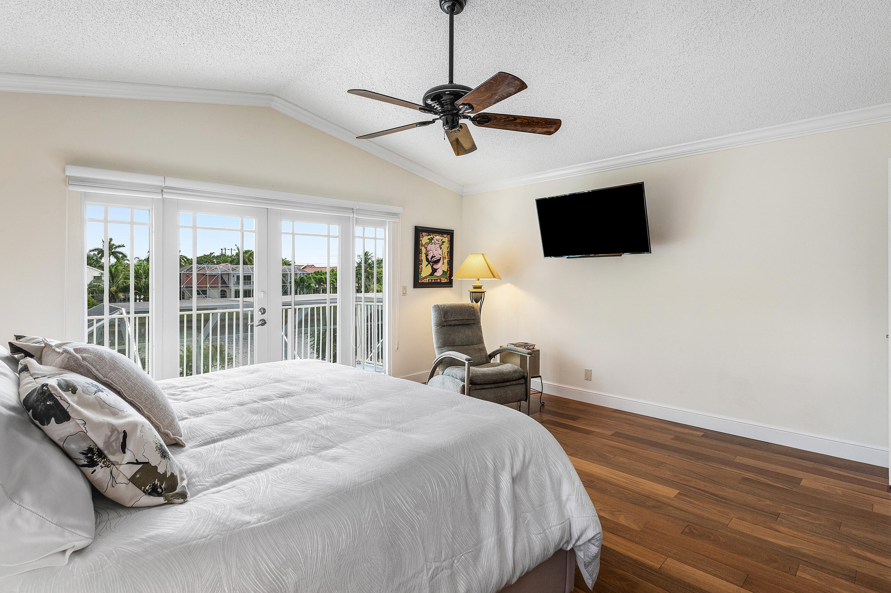10824 Tea Olive Lane Boca Raton, FL 33498 - Photo 26 of 76 a bedroom with a bed and a flat screen tv