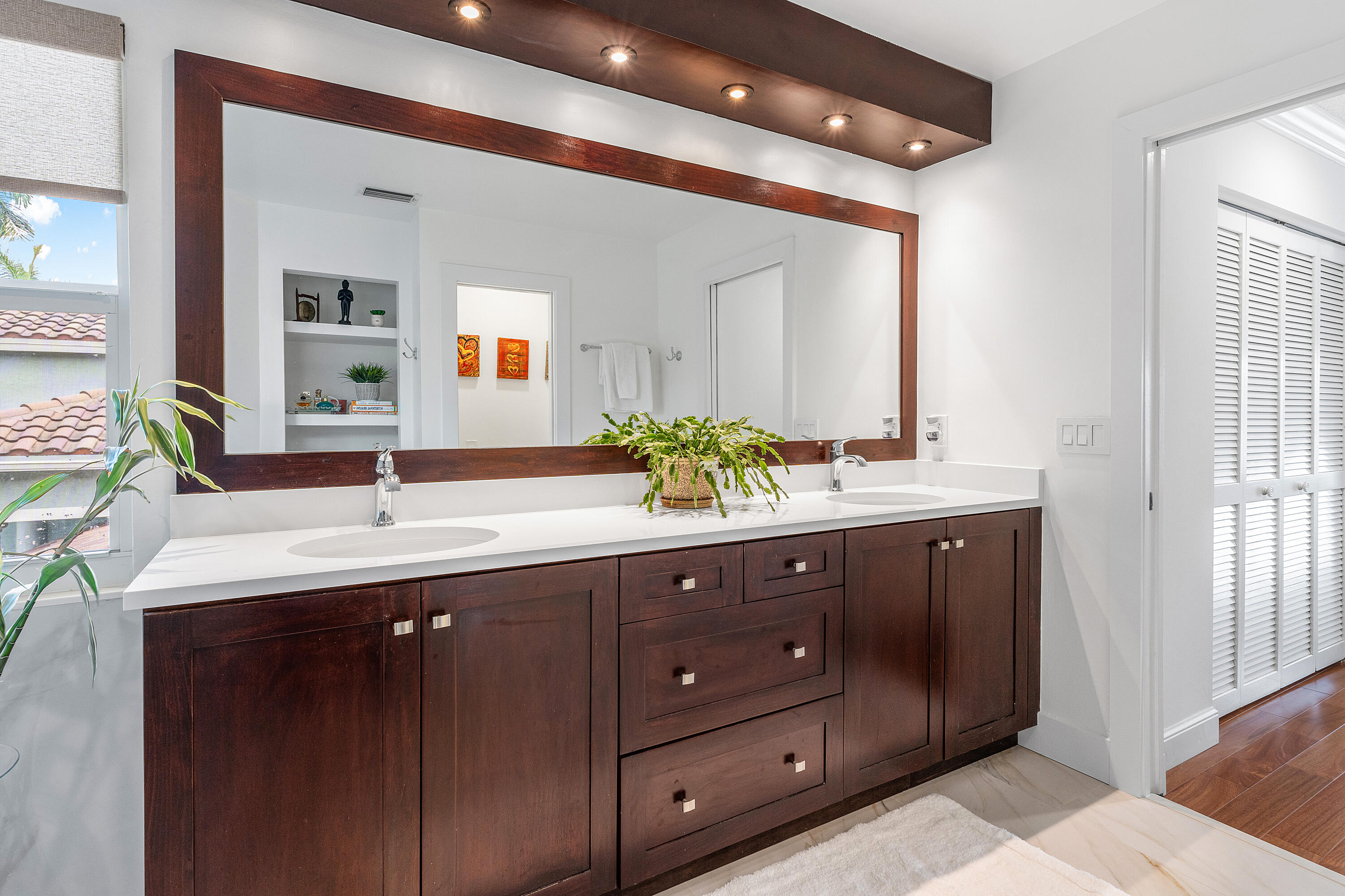 10824 Tea Olive Lane Boca Raton, FL 33498 - Photo 32 of 76 a bathroom with a sink double vanity and a mirror
