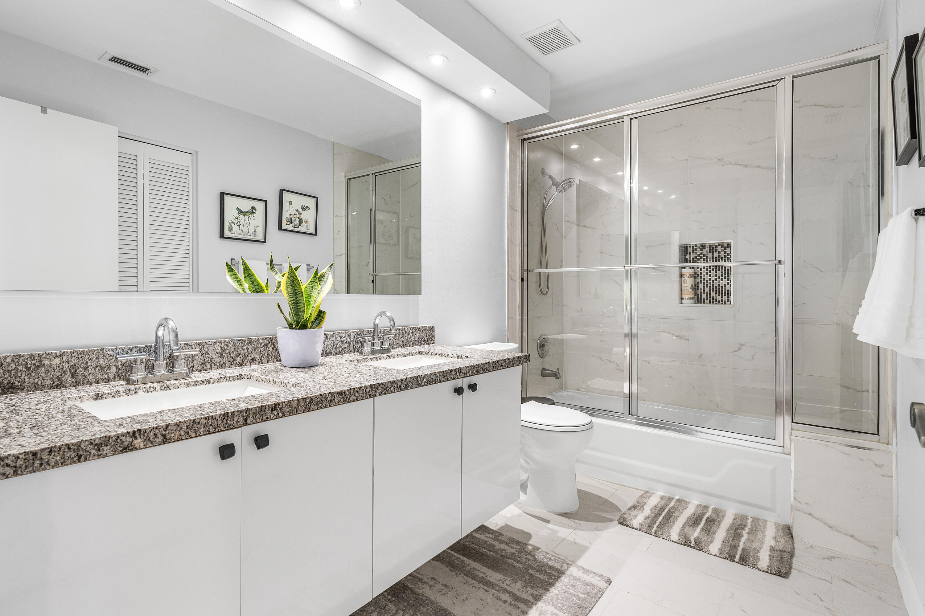10824 Tea Olive Lane Boca Raton, FL 33498 - Photo 36 of 76 a bathroom with a granite countertop sink toilet and shower