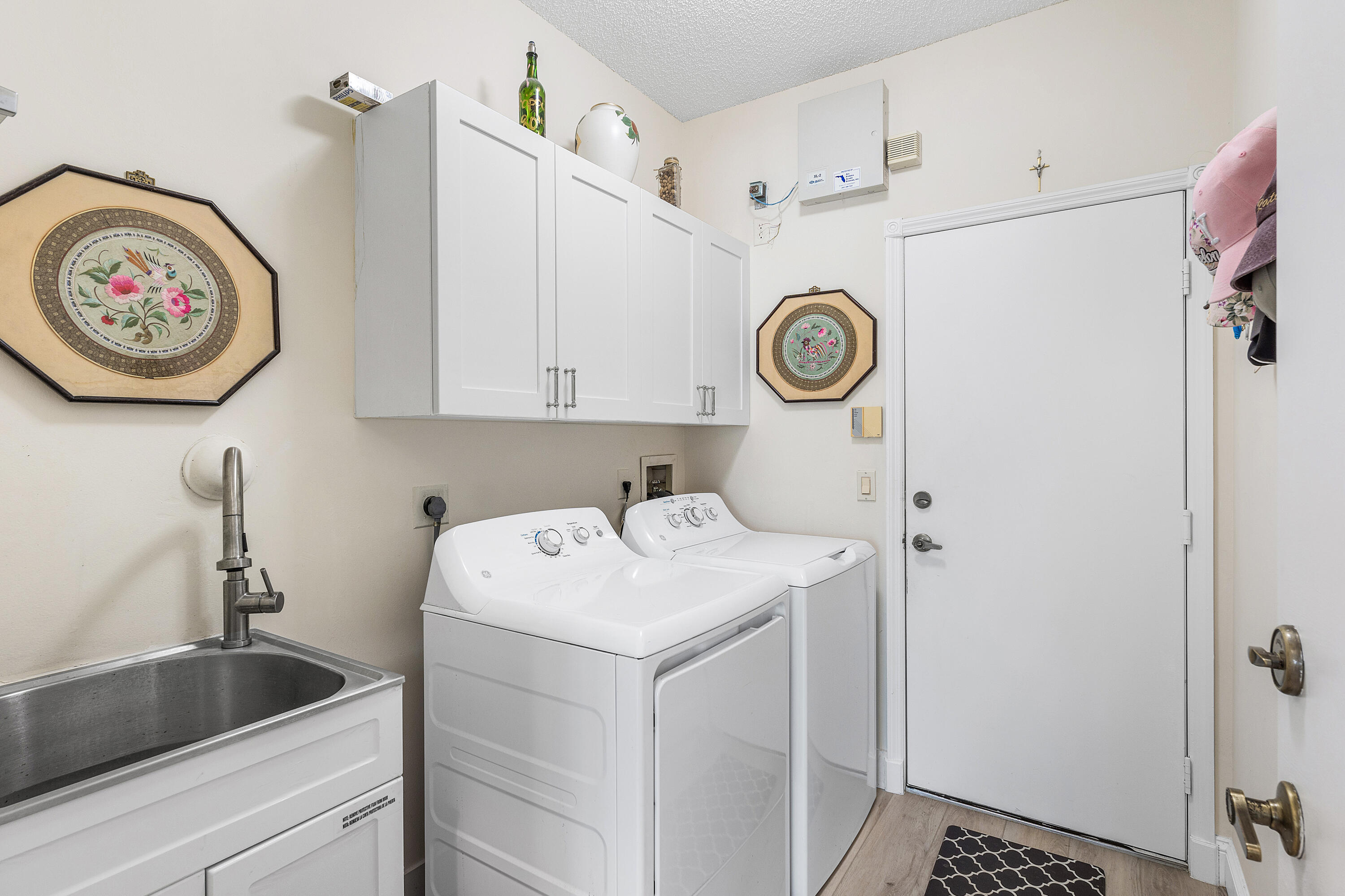 10824 Tea Olive Lane Boca Raton, FL 33498 - Photo 38 of 76 a view of a storage and utility room with washer and dryer