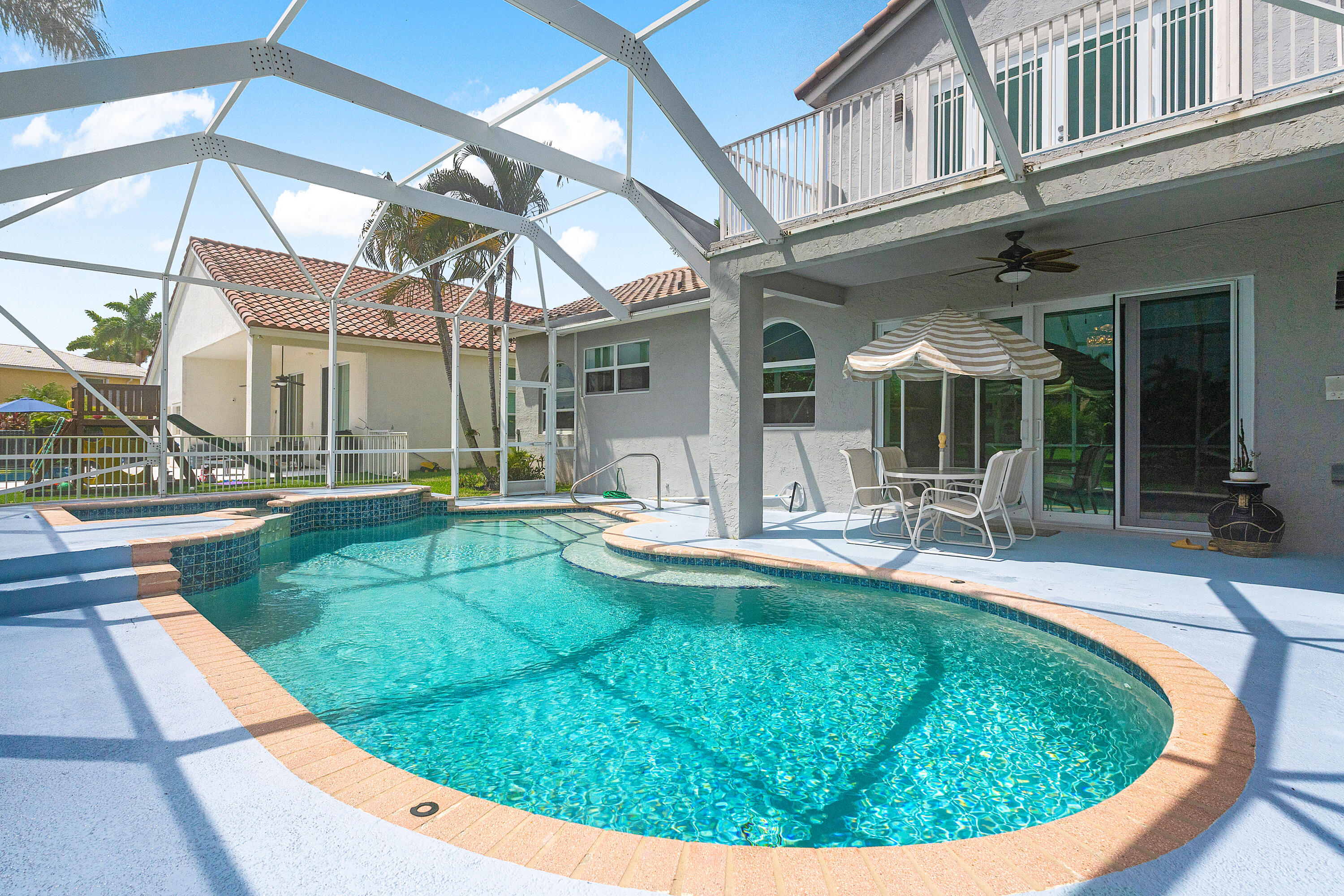 10824 Tea Olive Lane Boca Raton, FL 33498 - Photo 42 of 76 a view of a house with swimming pool