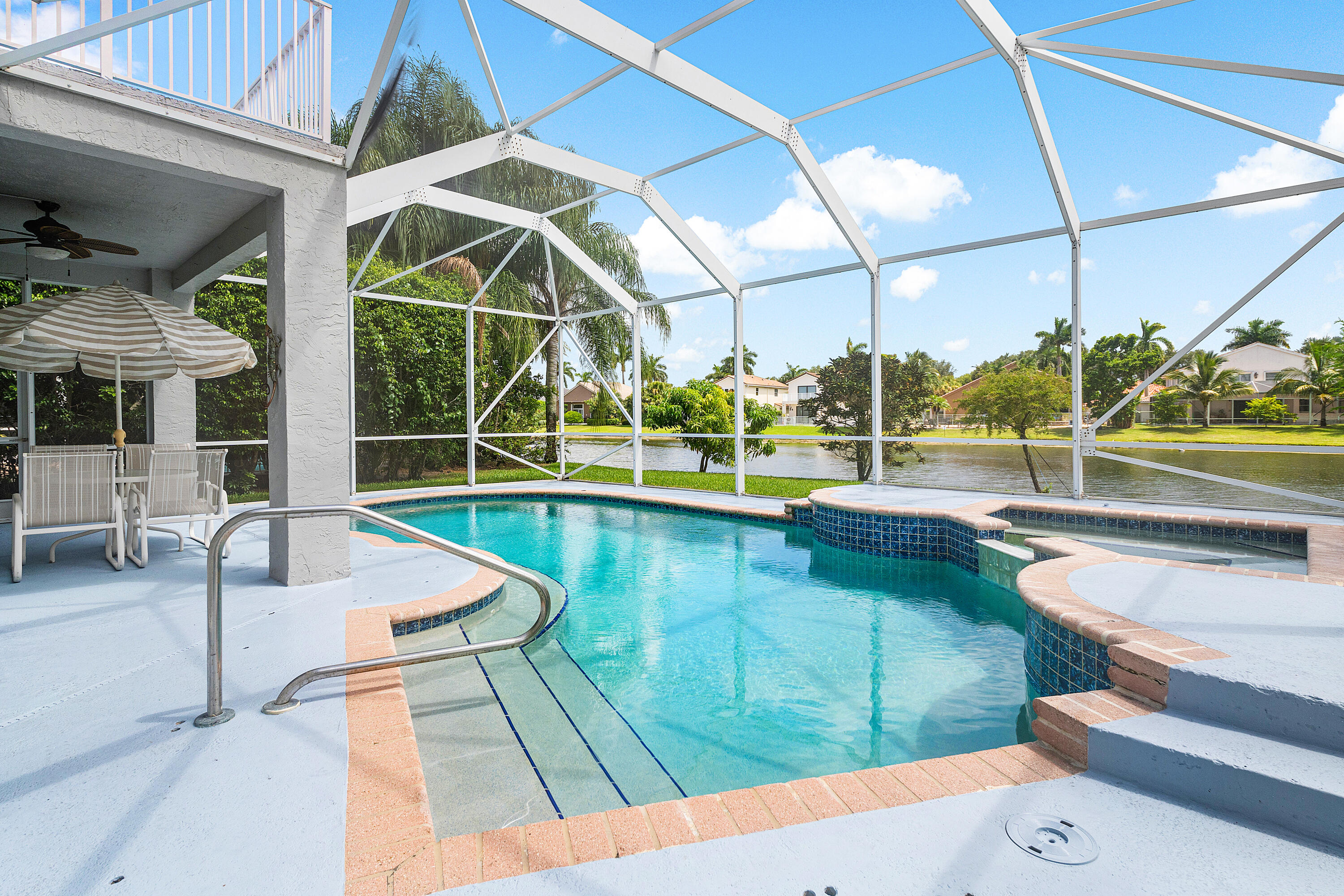 10824 Tea Olive Lane Boca Raton, FL 33498 - Photo 43 of 76 a view of a swimming pool with a patio