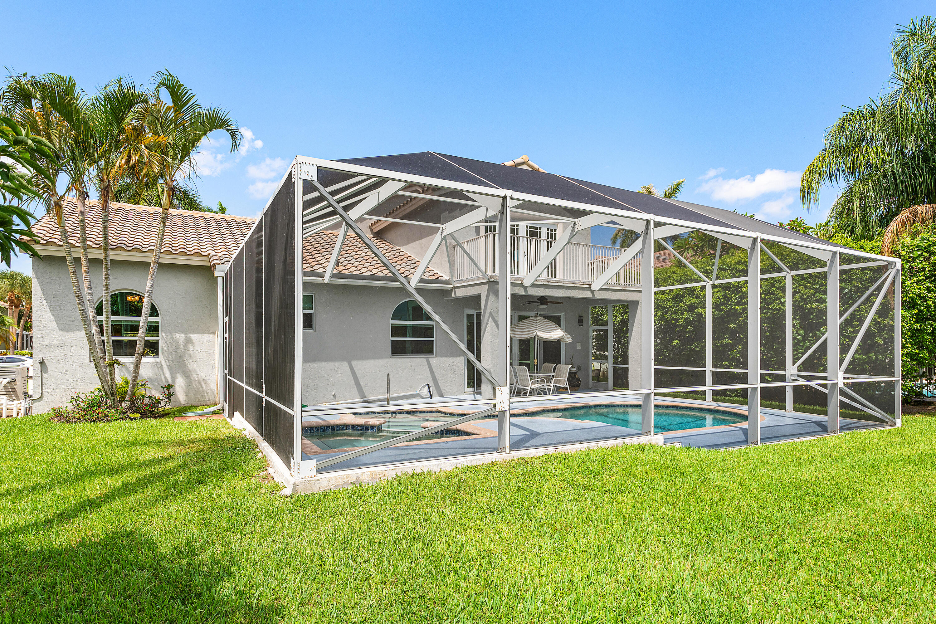 10824 Tea Olive Lane Boca Raton, FL 33498 - Photo 45 of 76 a view of a house with a yard and a large tree