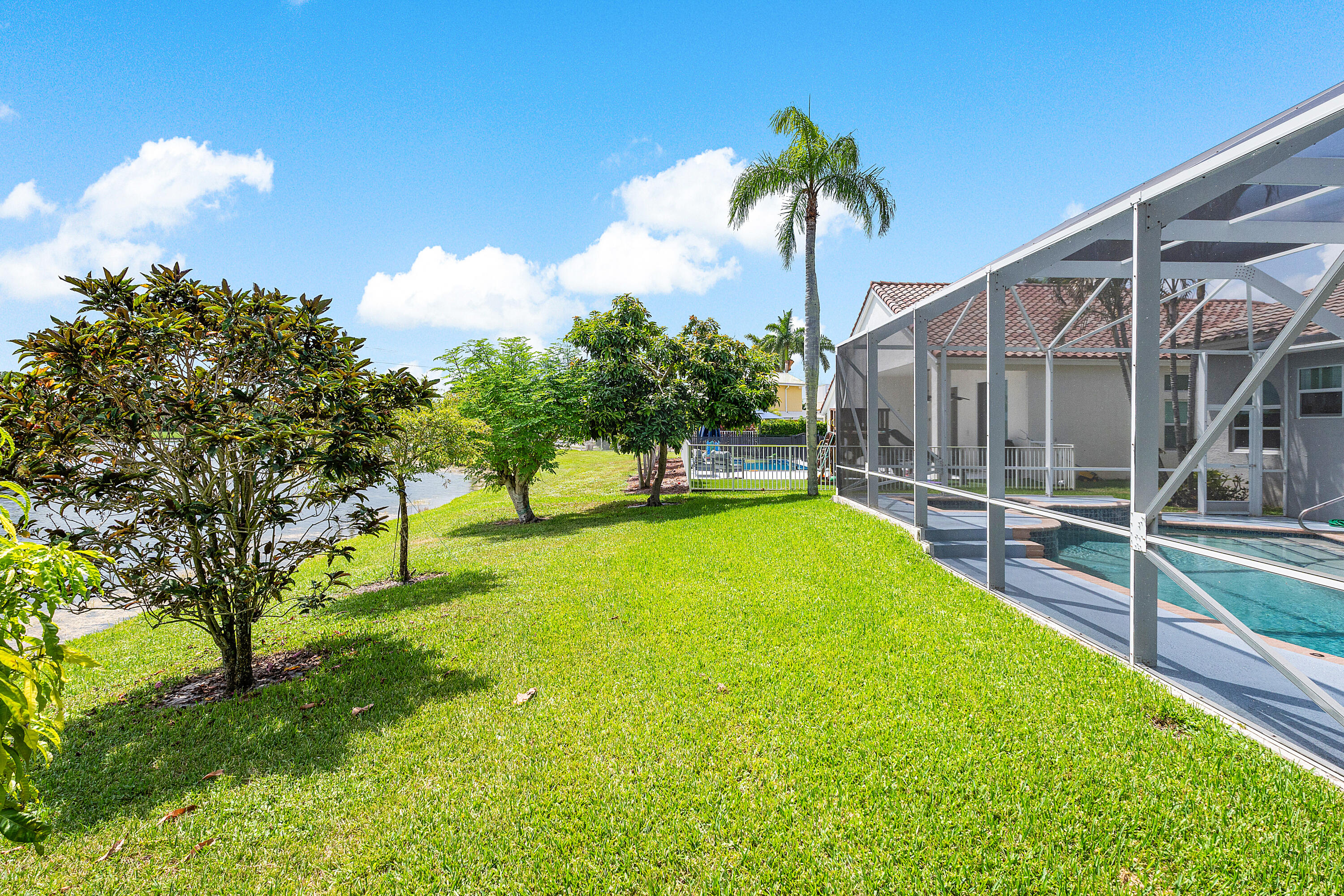 10824 Tea Olive Lane Boca Raton, FL 33498 - Photo 46 of 76 a view of yard with swimming pool and seating