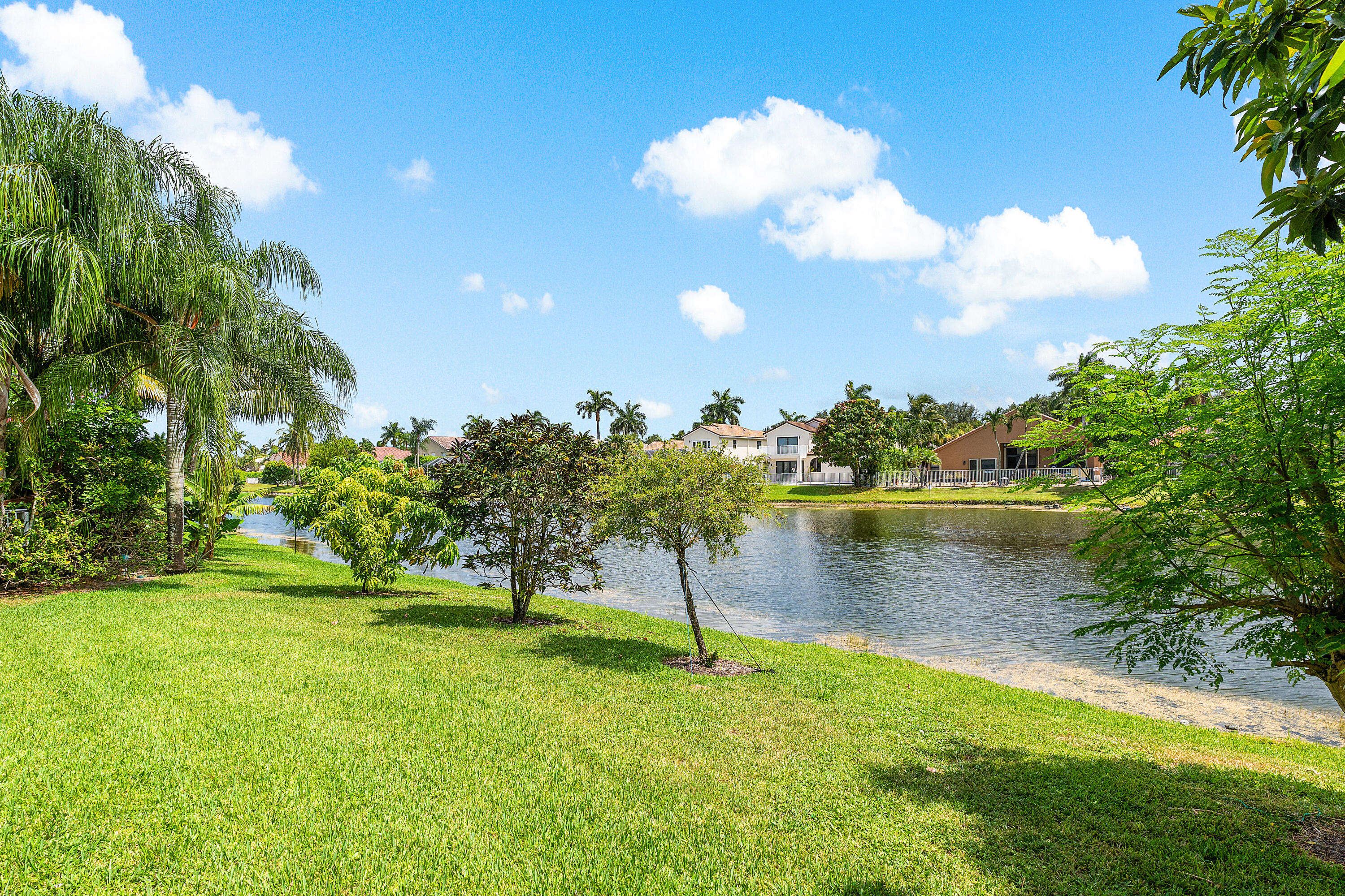 10824 Tea Olive Lane Boca Raton, FL 33498 - Photo 47 of 76 a view of a lake with houses