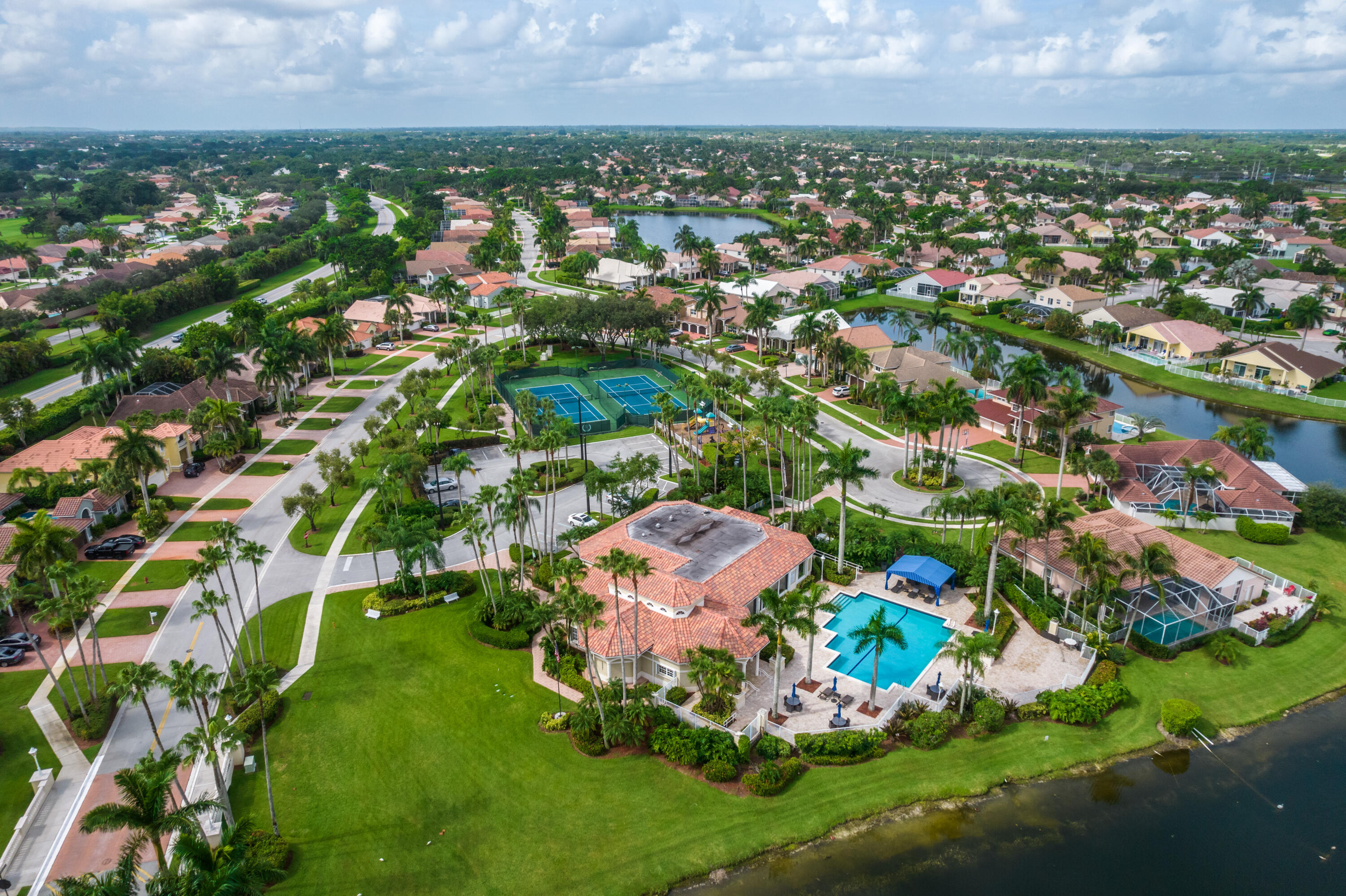 10824 Tea Olive Lane Boca Raton, FL 33498 - Photo 52 of 76 an aerial view of residential houses with outdoor space and trees