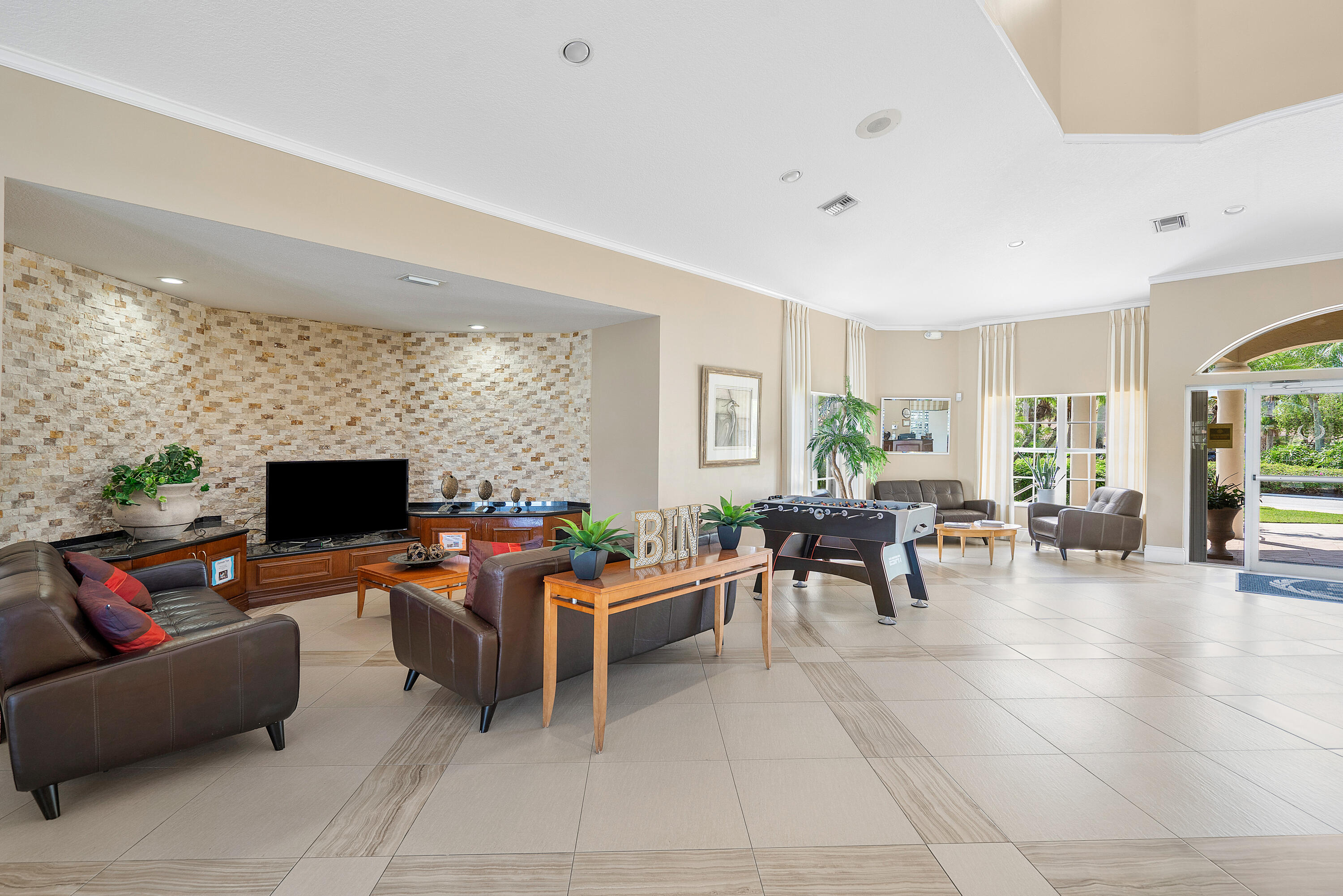 10824 Tea Olive Lane Boca Raton, FL 33498 - Photo 57 of 76 a living room with furniture and a flat screen tv