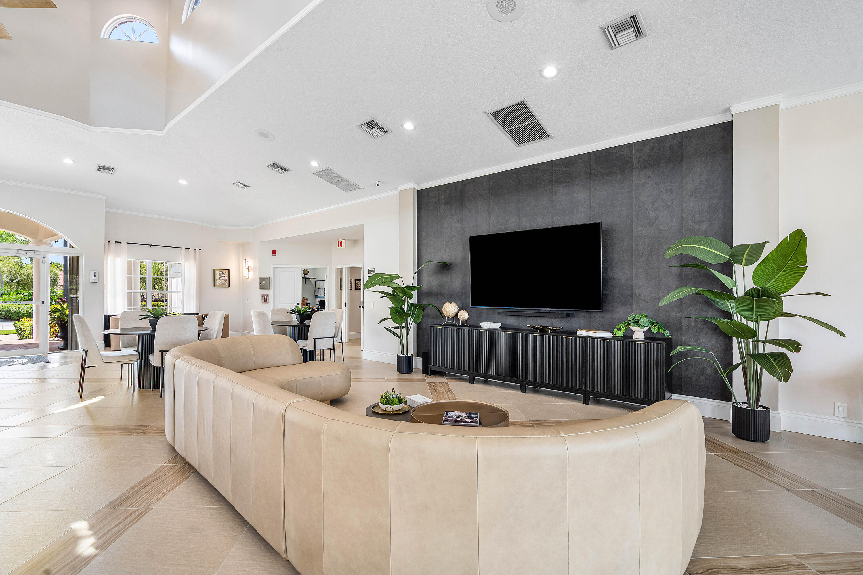 10824 Tea Olive Lane Boca Raton, FL 33498 - Photo 63 of 76 a living room with furniture and a flat screen tv