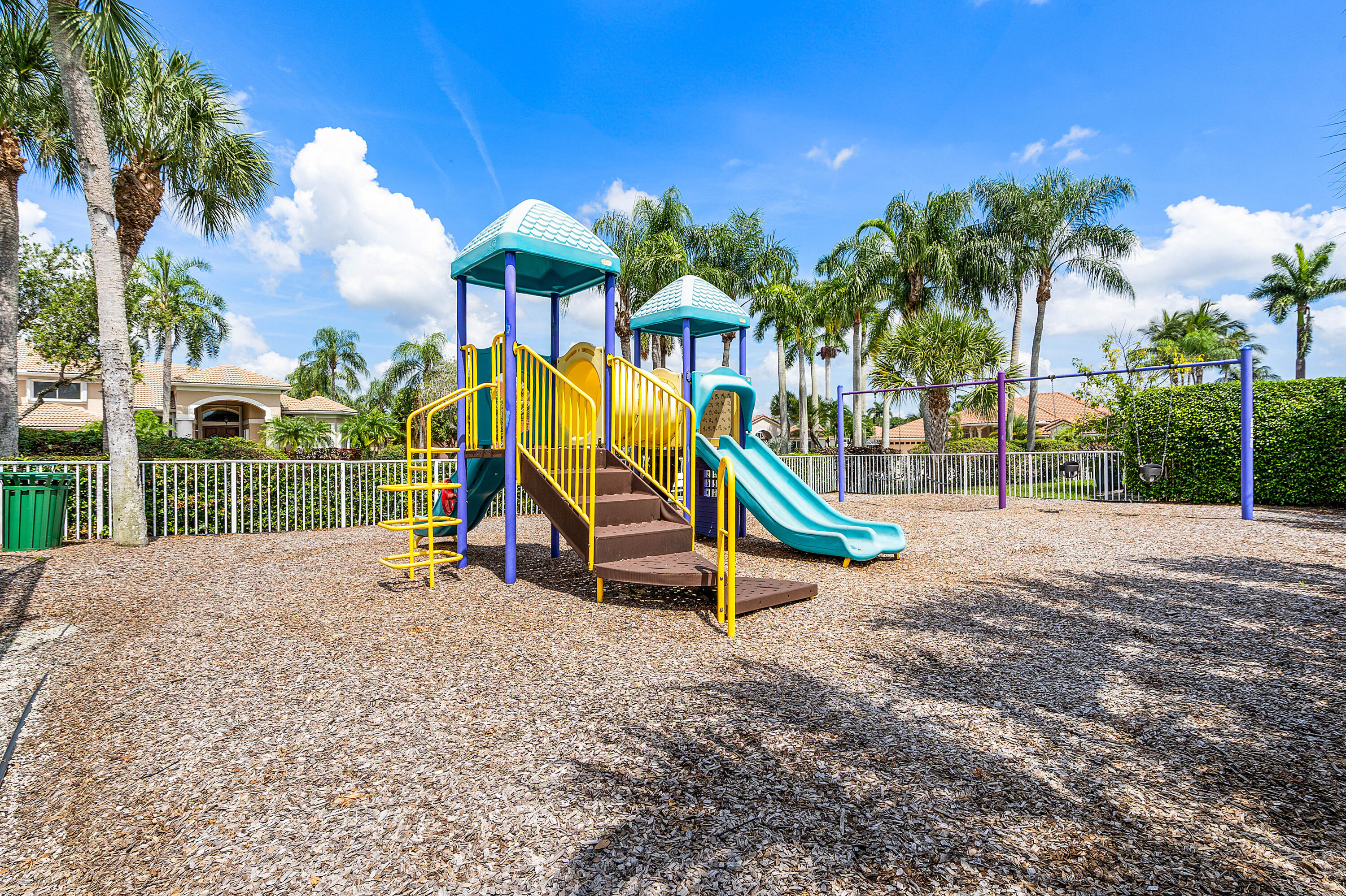 10824 Tea Olive Lane Boca Raton, FL 33498 - Photo 69 of 76 a view of a park with slide and potted plants