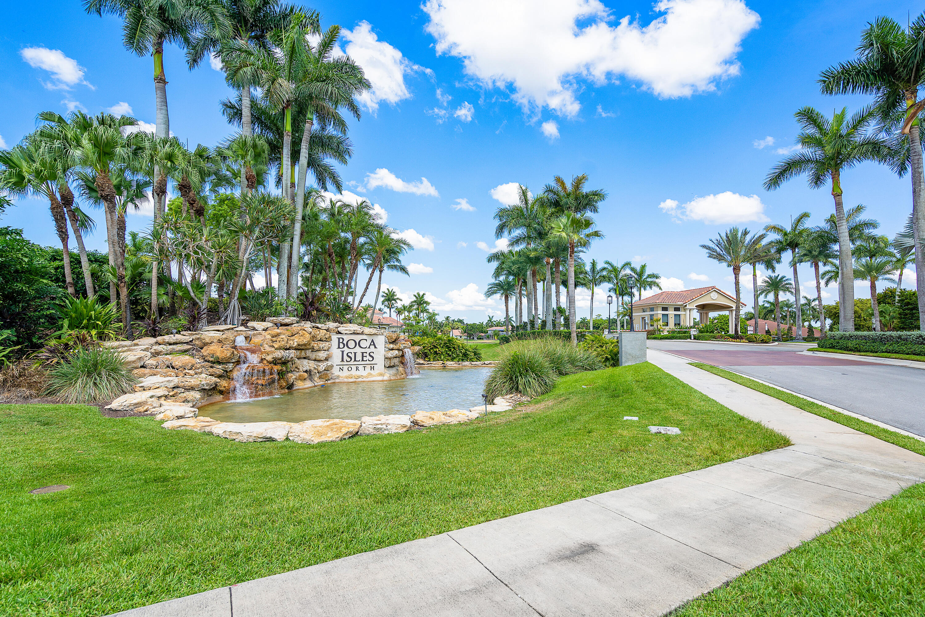 10824 Tea Olive Lane Boca Raton, FL 33498 - Photo 75 of 76 a view of a swimming pool with a garden