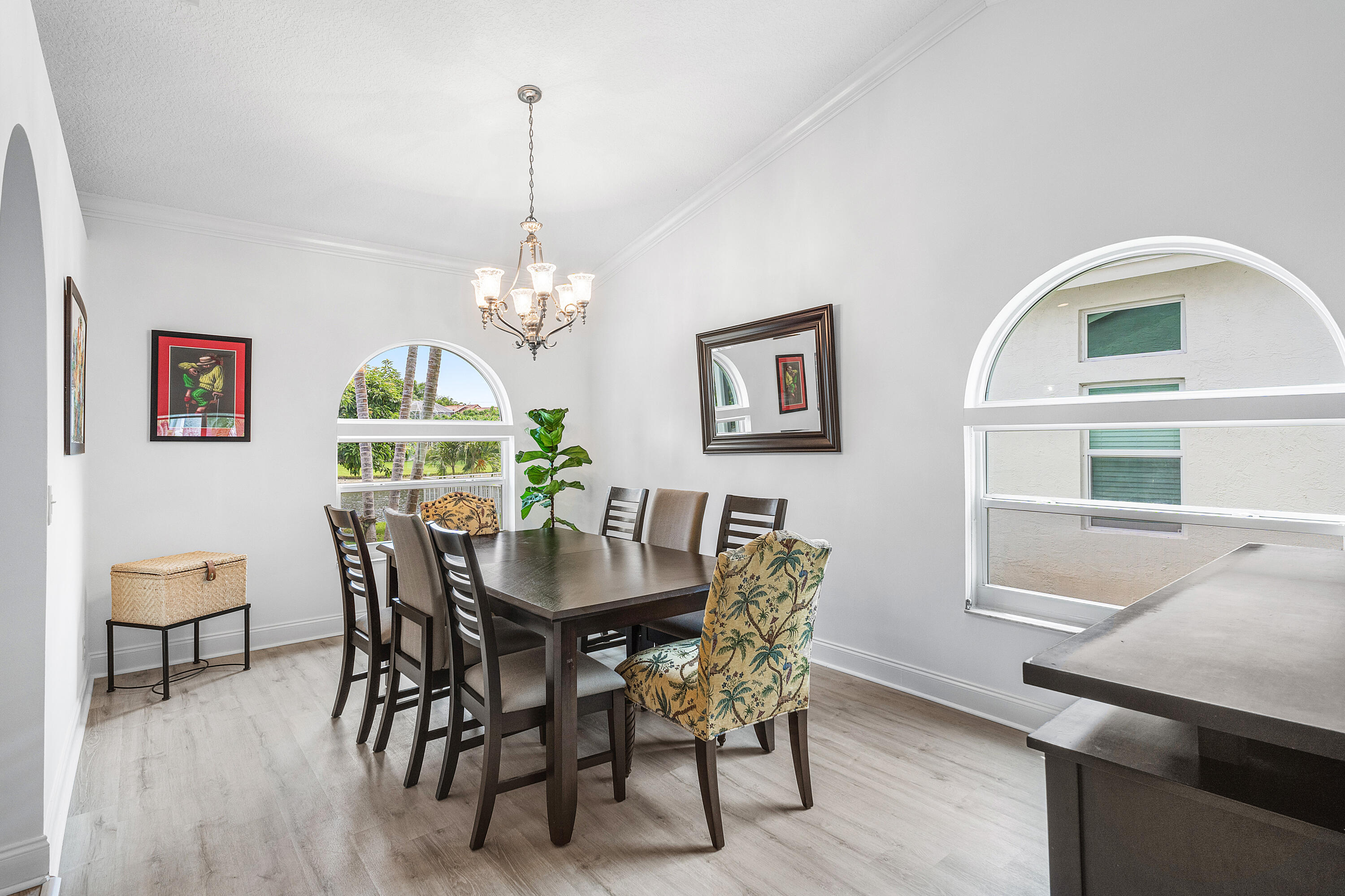 10824 Tea Olive Lane Boca Raton, FL 33498 - Photo 10 of 76 a view of a dining room with furniture and chandelier