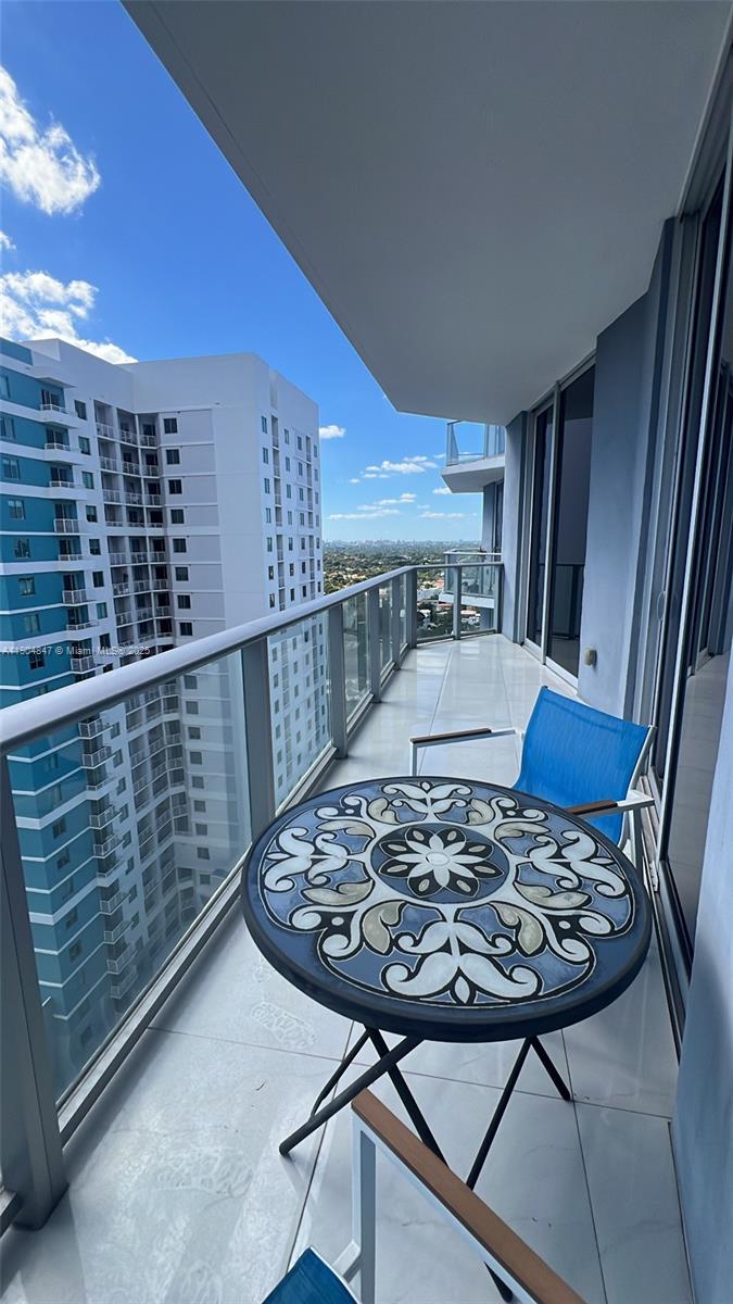Brickell Miami, FL 33130 - Photo 11 of 12 a view of a couches and table in a balcony