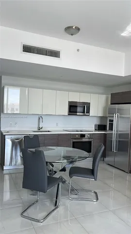 a living room with furniture window and a table