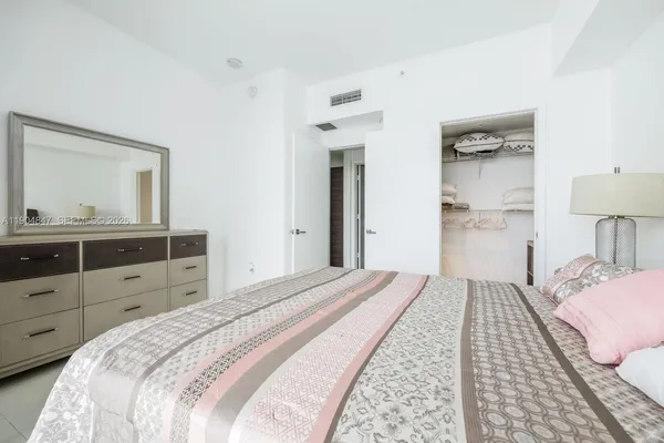 a bathroom with a double vanity sink mirror and toilet