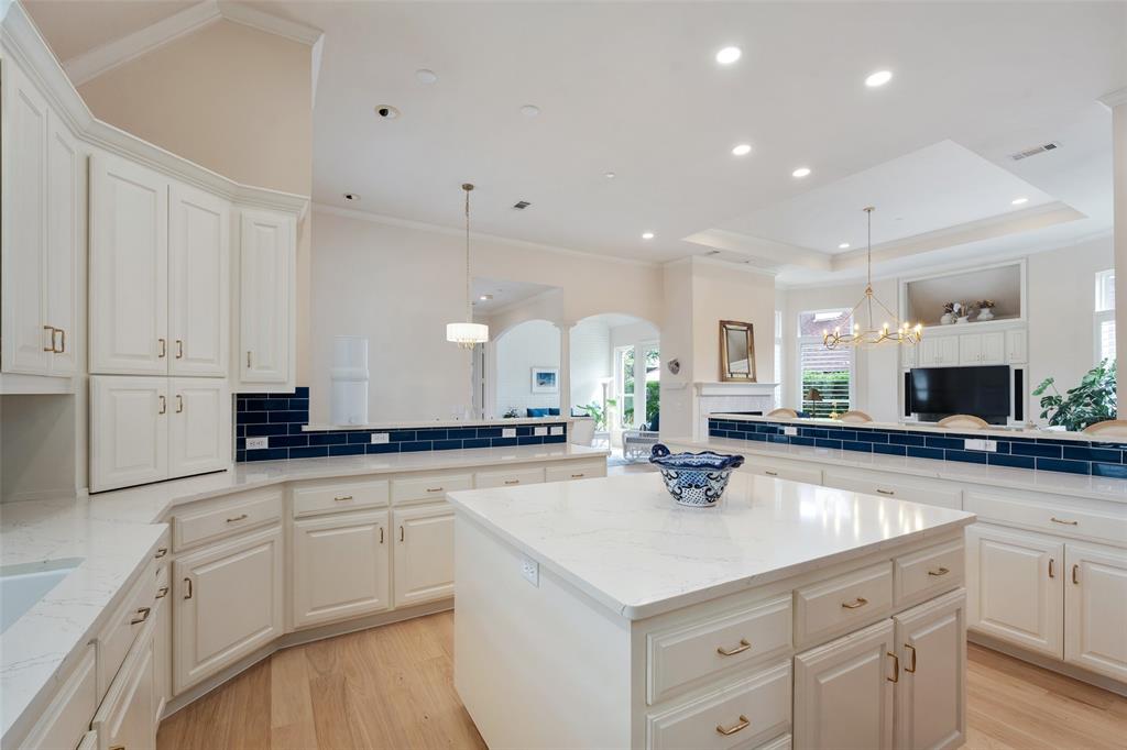 14725 Celestial Place Addison, TX 75254 - Photo 20 of 30 Large Kitchen Island is Surrounded by Multiple Prep Areas with 12-Foot Ceilings