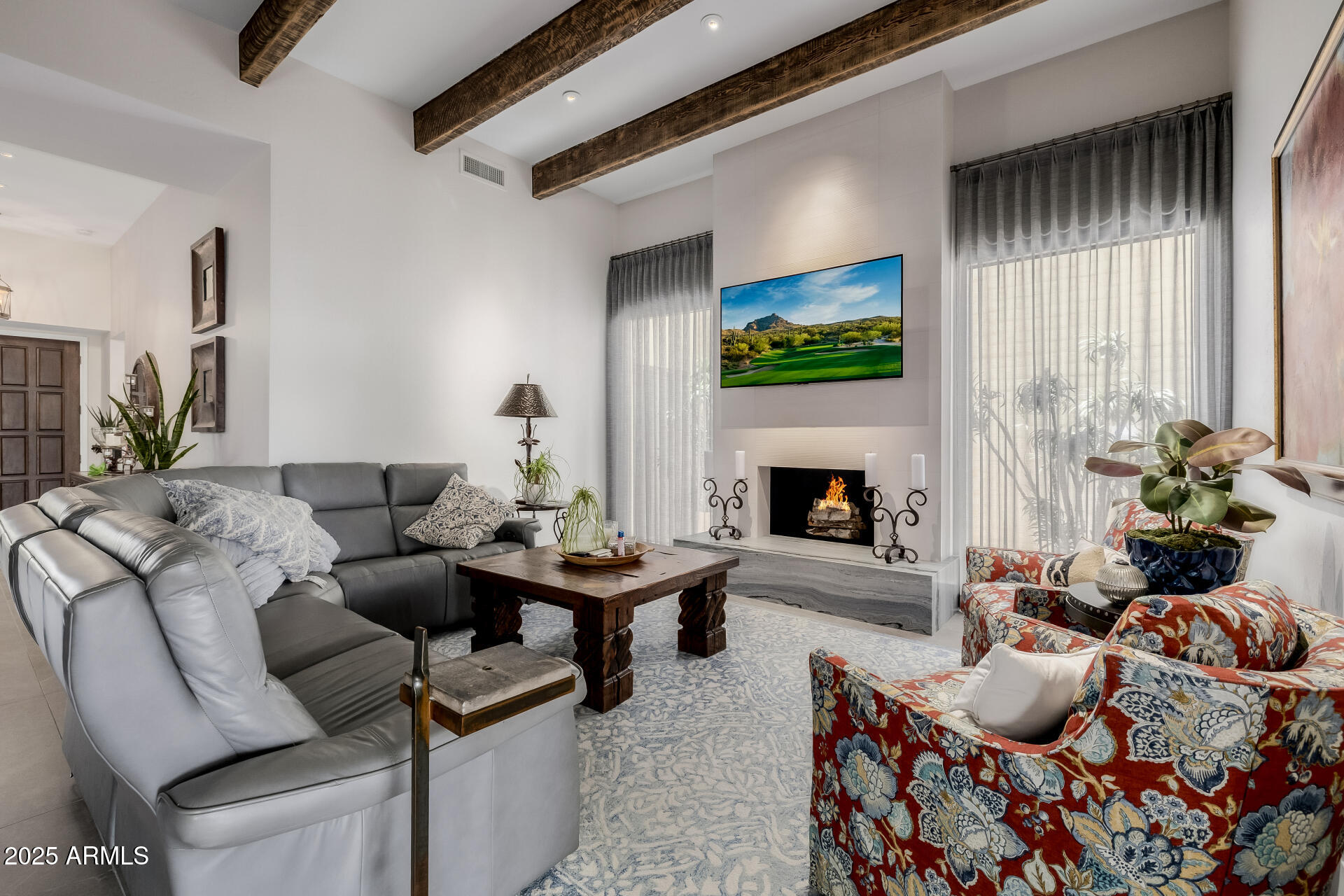 7322 East McLellan Boulevard Scottsdale, AZ 85250 - Photo 11 of 64 a living room with furniture and a fireplace