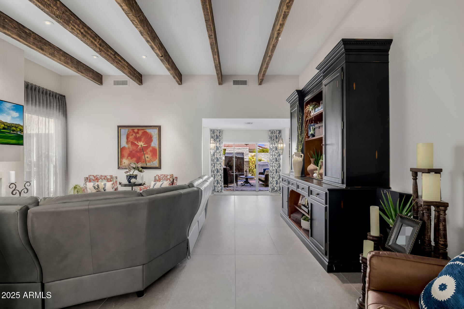 7322 East McLellan Boulevard Scottsdale, AZ 85250 - Photo 12 of 64 a living room with furniture and a flat screen tv