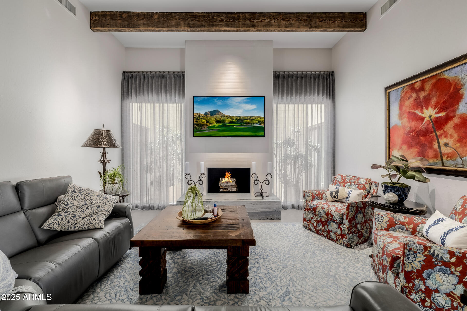 7322 East McLellan Boulevard Scottsdale, AZ 85250 - Photo 13 of 64 a living room with furniture and a fireplace