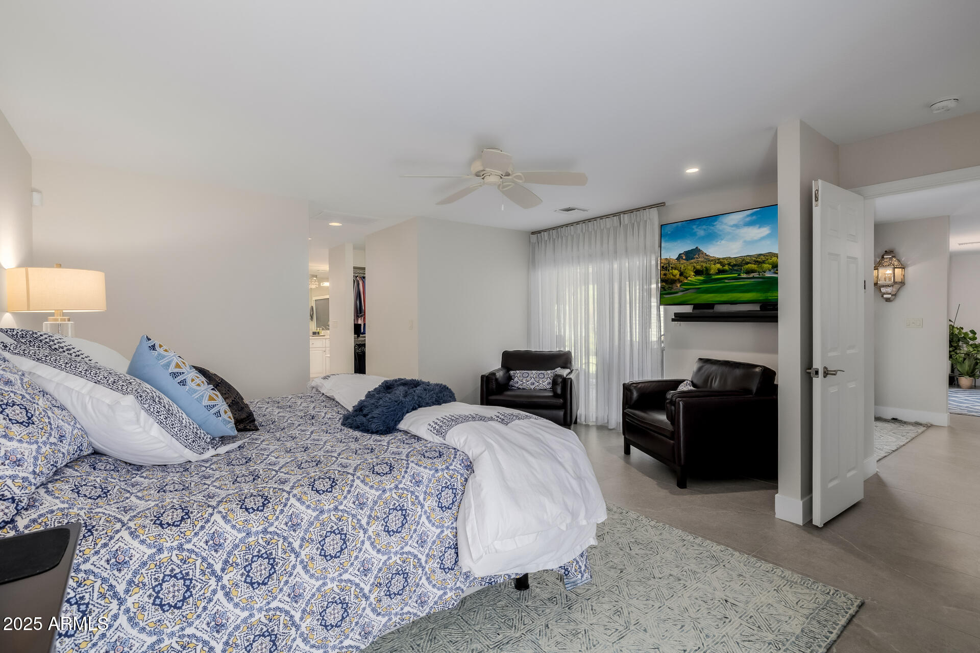 7322 East McLellan Boulevard Scottsdale, AZ 85250 - Photo 28 of 64 a bedroom with a bed and furniture