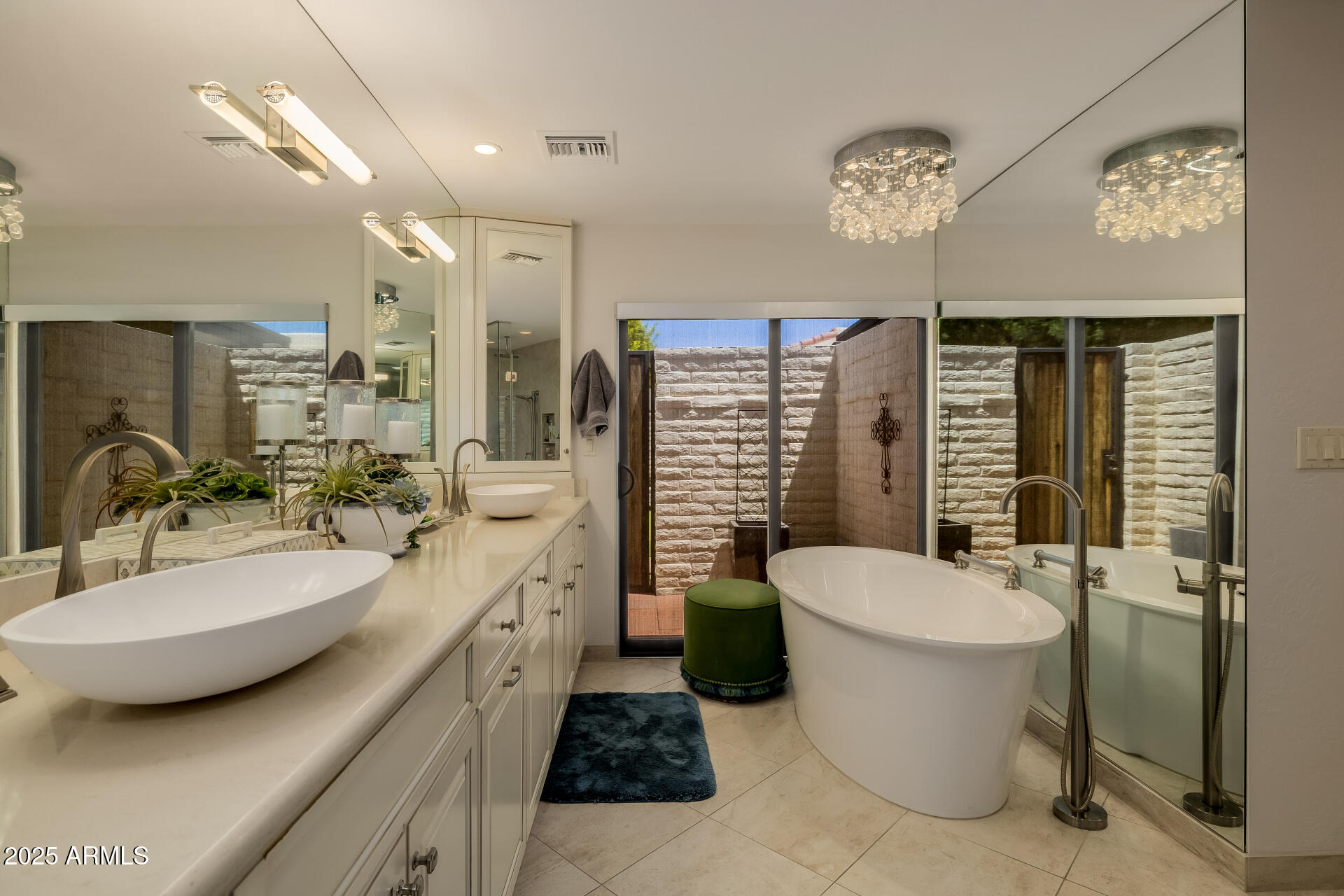 7322 East McLellan Boulevard Scottsdale, AZ 85250 - Photo 32 of 64 a bathroom with a double vanity sink a mirror a toilet and a shower