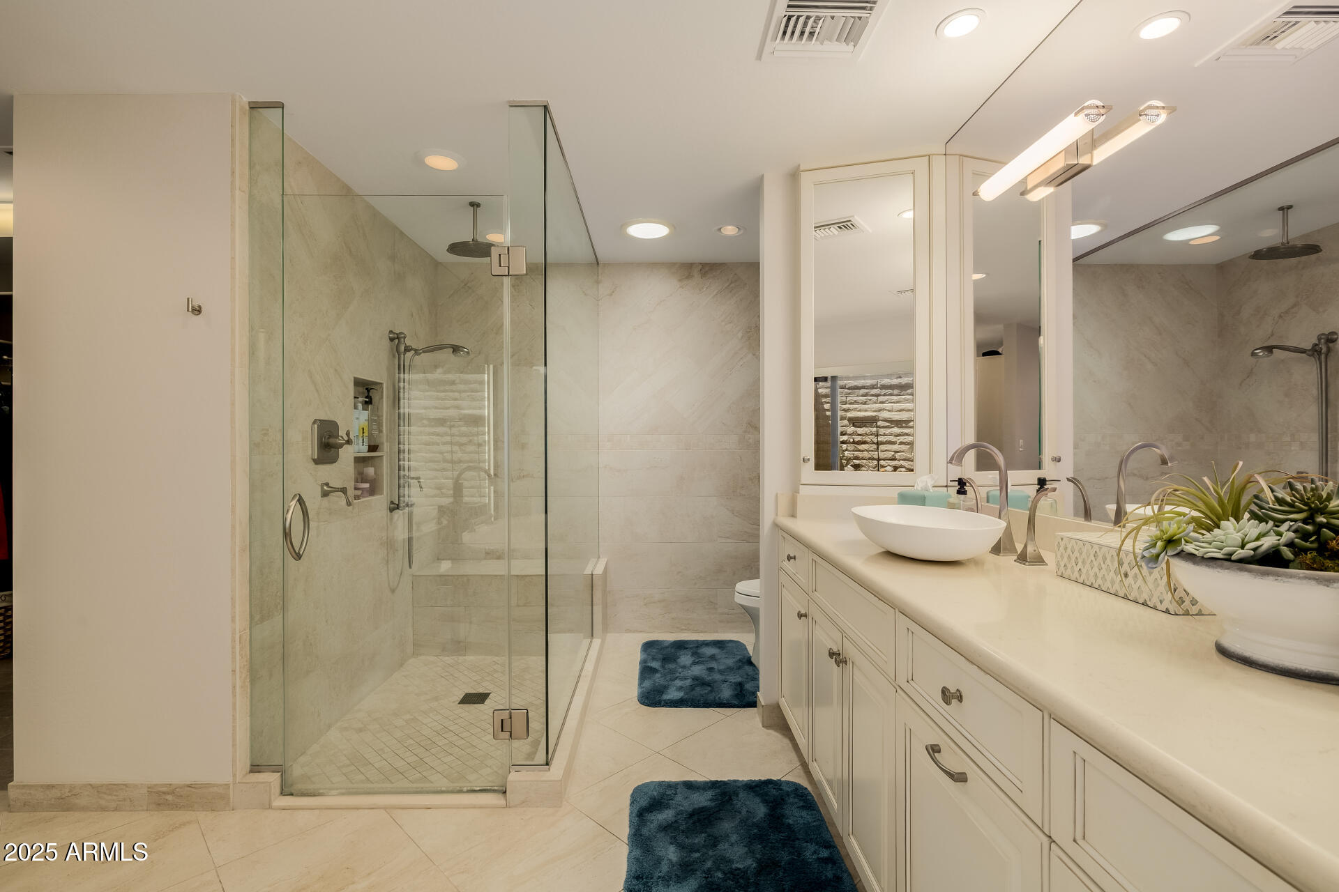 7322 East McLellan Boulevard Scottsdale, AZ 85250 - Photo 36 of 64 a spacious bathroom with a shower sink and mirror