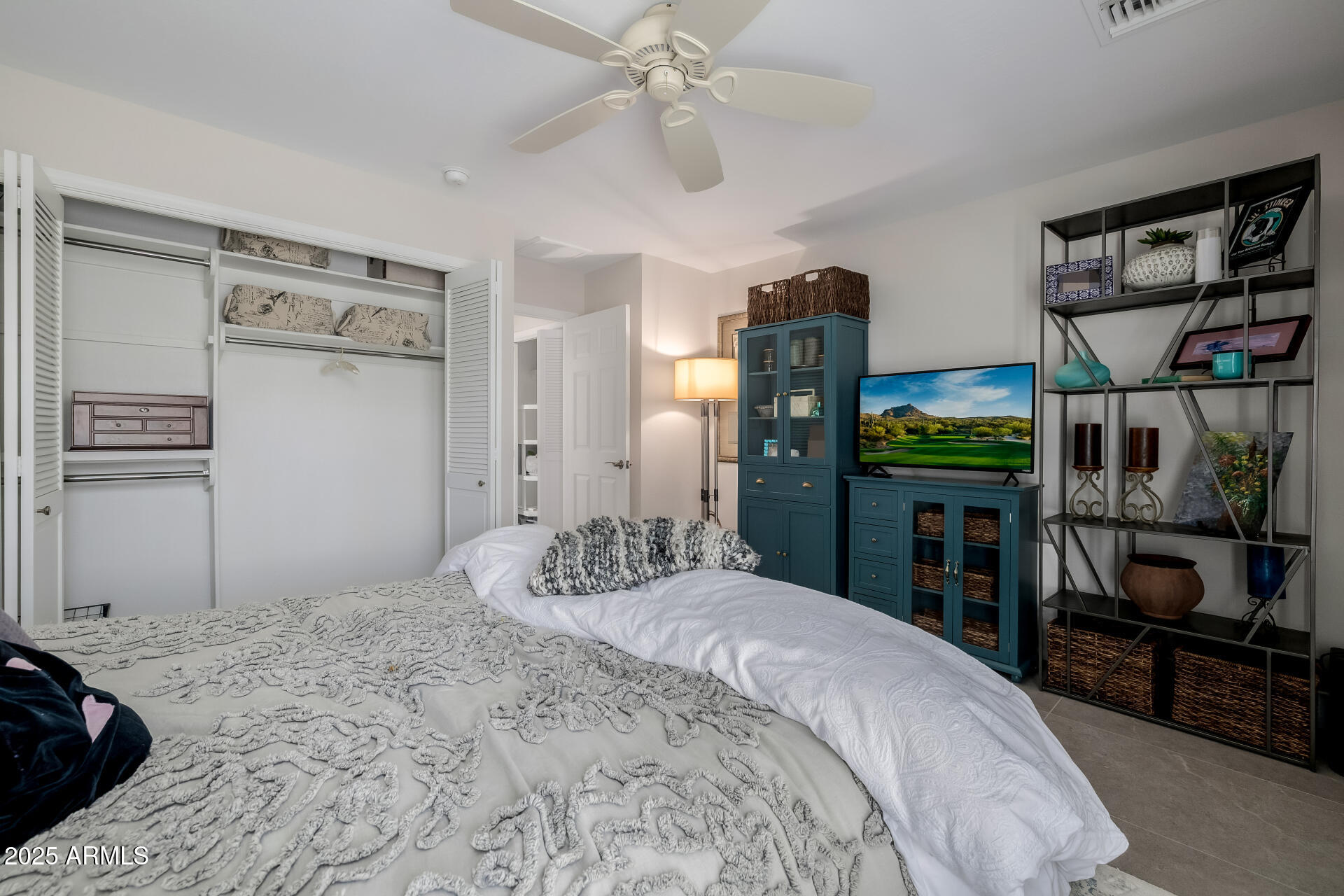 7322 East McLellan Boulevard Scottsdale, AZ 85250 - Photo 37 of 64 a bedroom with a bed and a flat screen tv