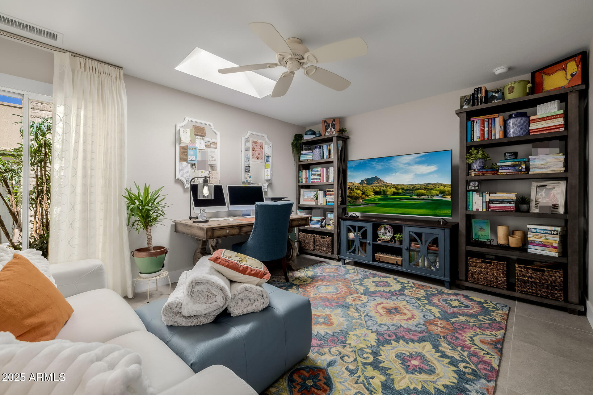 7322 East McLellan Boulevard Scottsdale, AZ 85250 - Photo 43 of 64 a living room with furniture and a flat screen tv