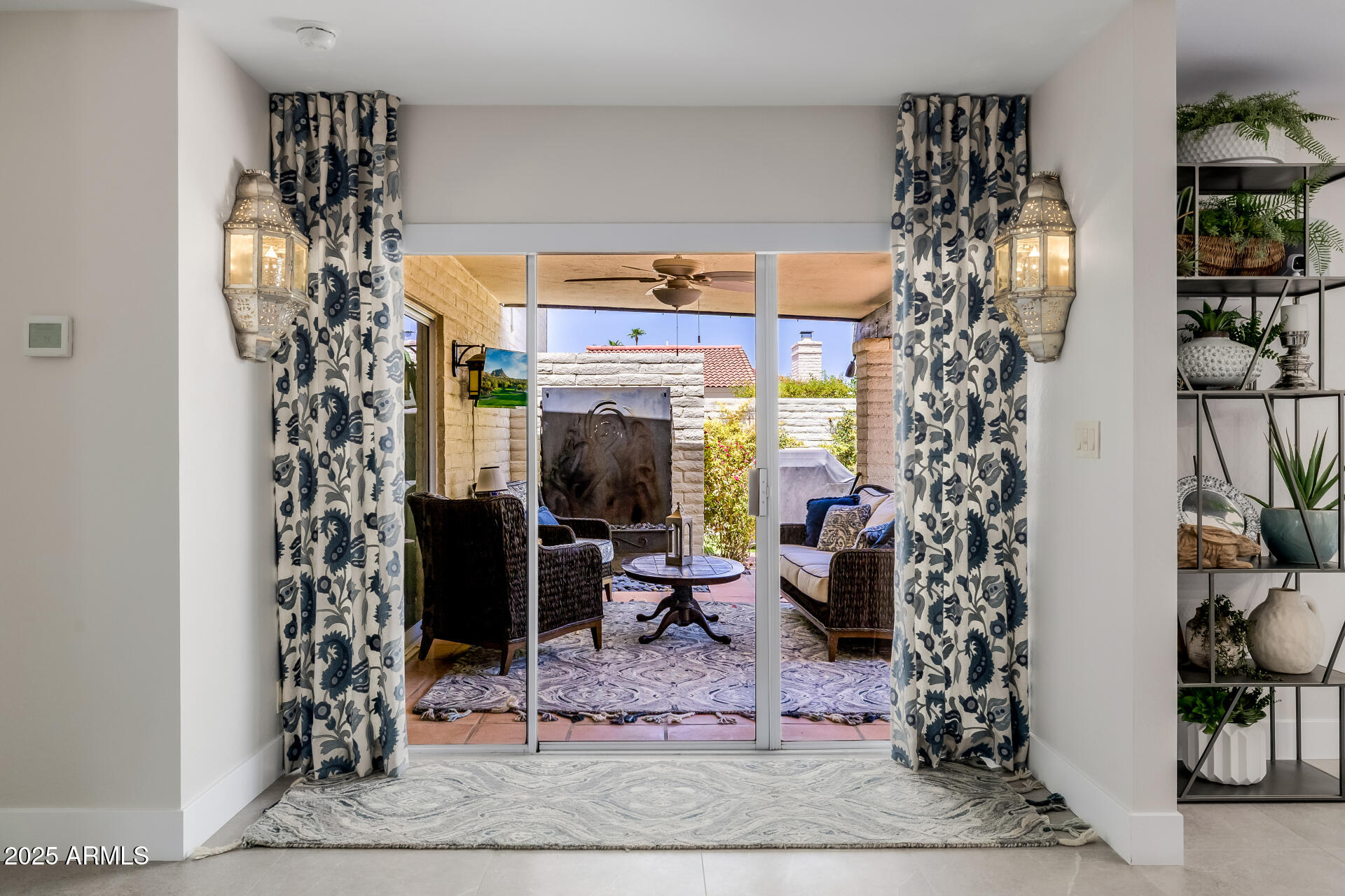 7322 East McLellan Boulevard Scottsdale, AZ 85250 - Photo 45 of 64 a view of a hallway with paintings on the wall and potted plants