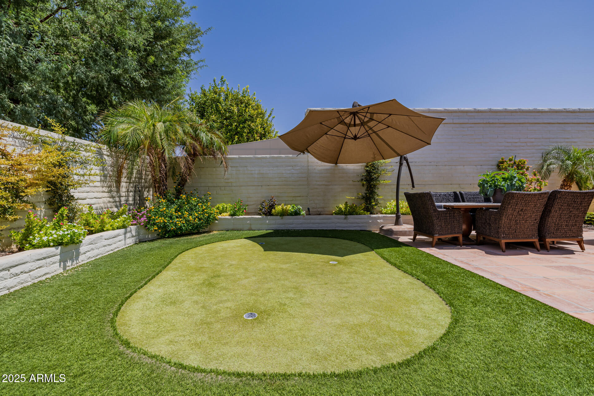 7322 East McLellan Boulevard Scottsdale, AZ 85250 - Photo 50 of 64 a view of a swimming pool with a patio