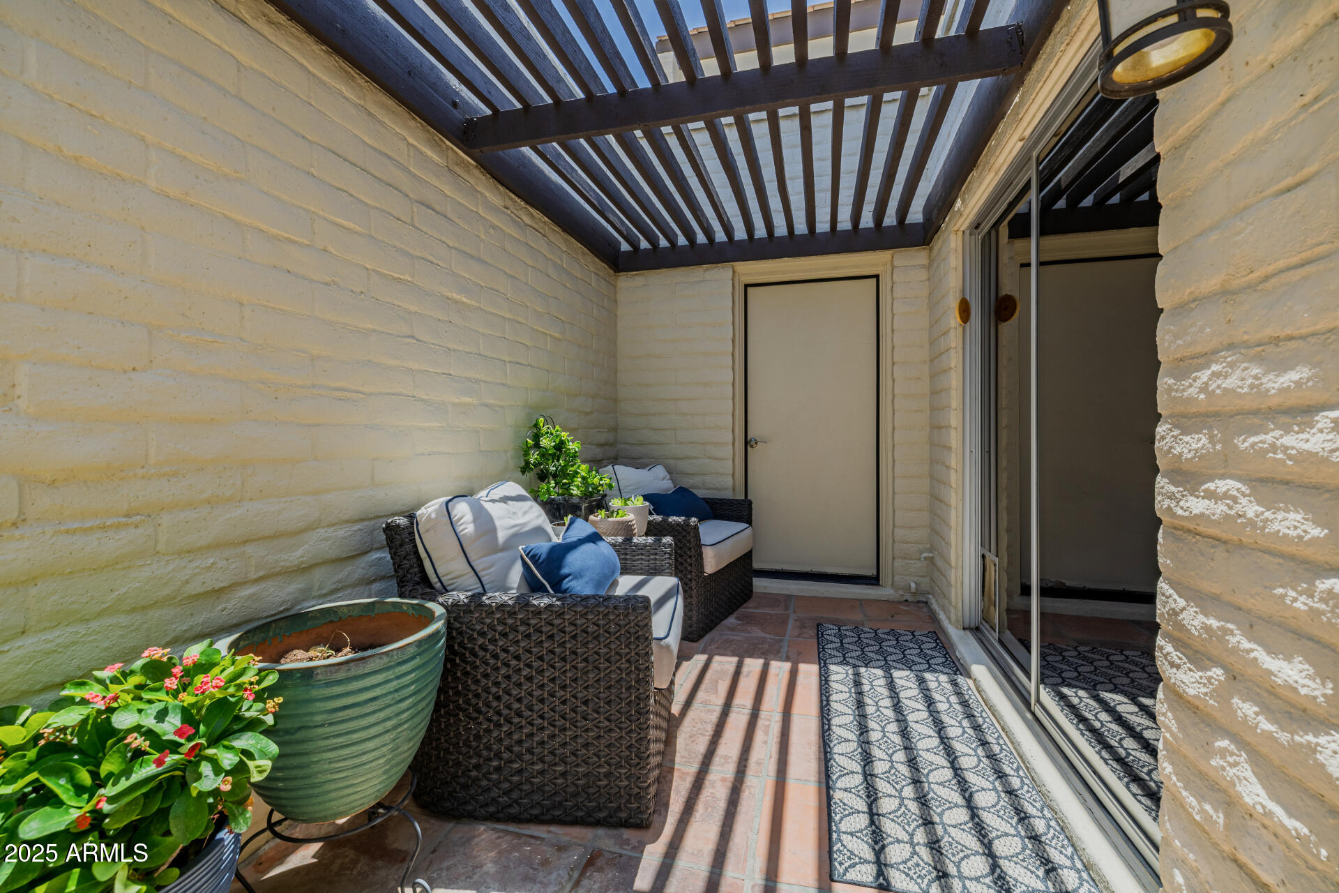 7322 East McLellan Boulevard Scottsdale, AZ 85250 - Photo 53 of 64 a balcony with wooden floor and a potted plant