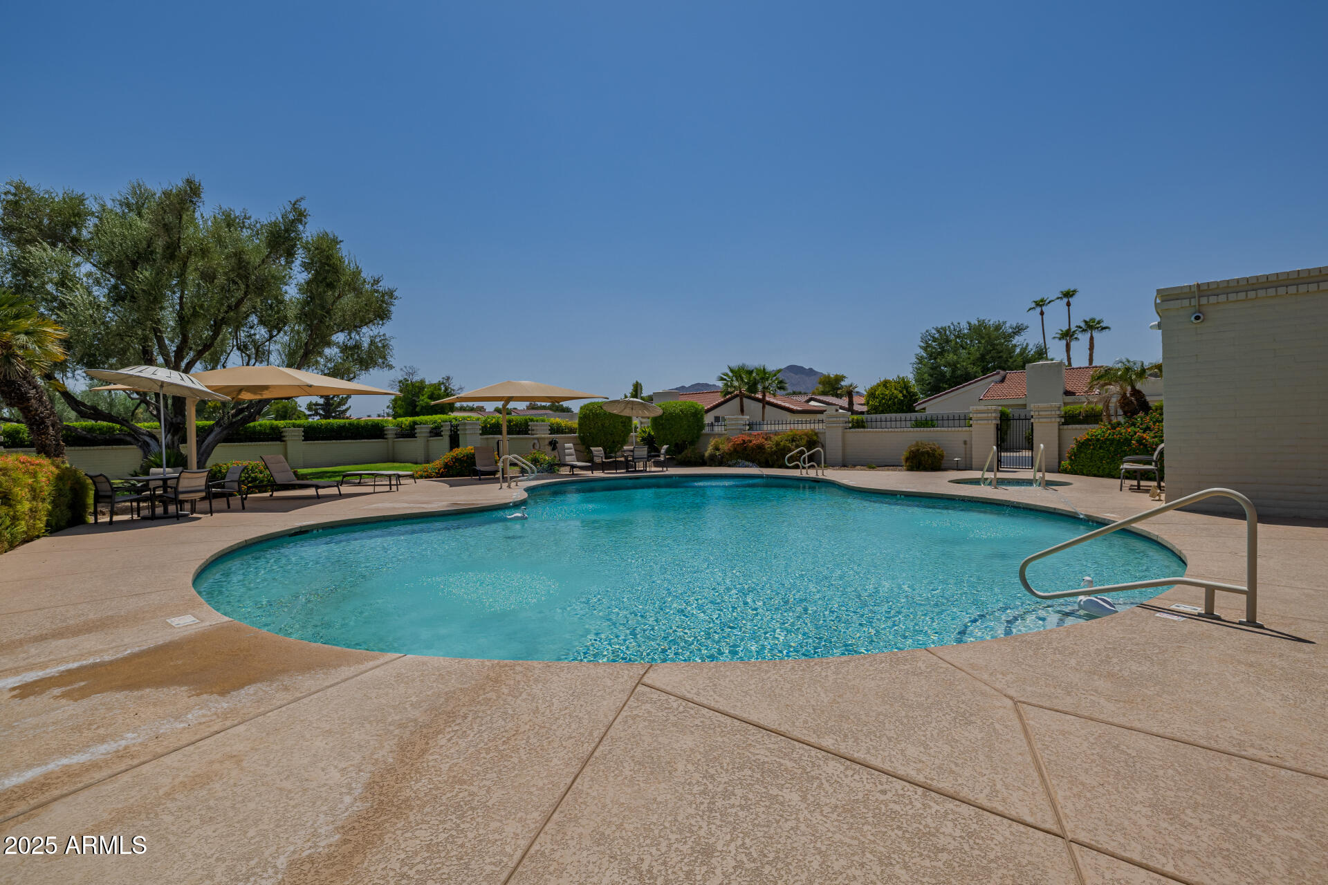 7322 East McLellan Boulevard Scottsdale, AZ 85250 - Photo 57 of 64 a view of a swimming pool with a patio